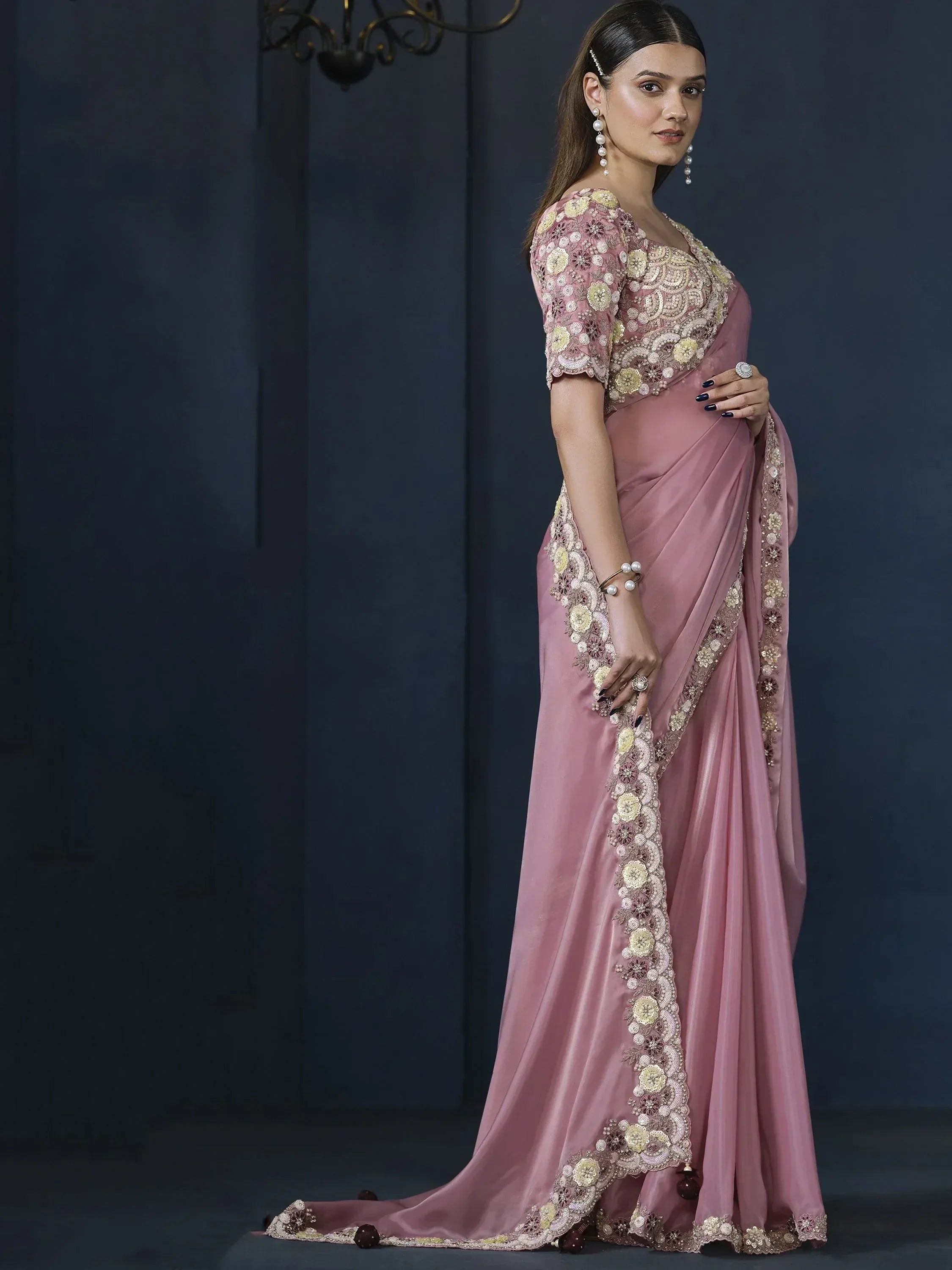 Elegant pink saree with floral embroidery and gold detailing, perfect for Indian ethnic occasions