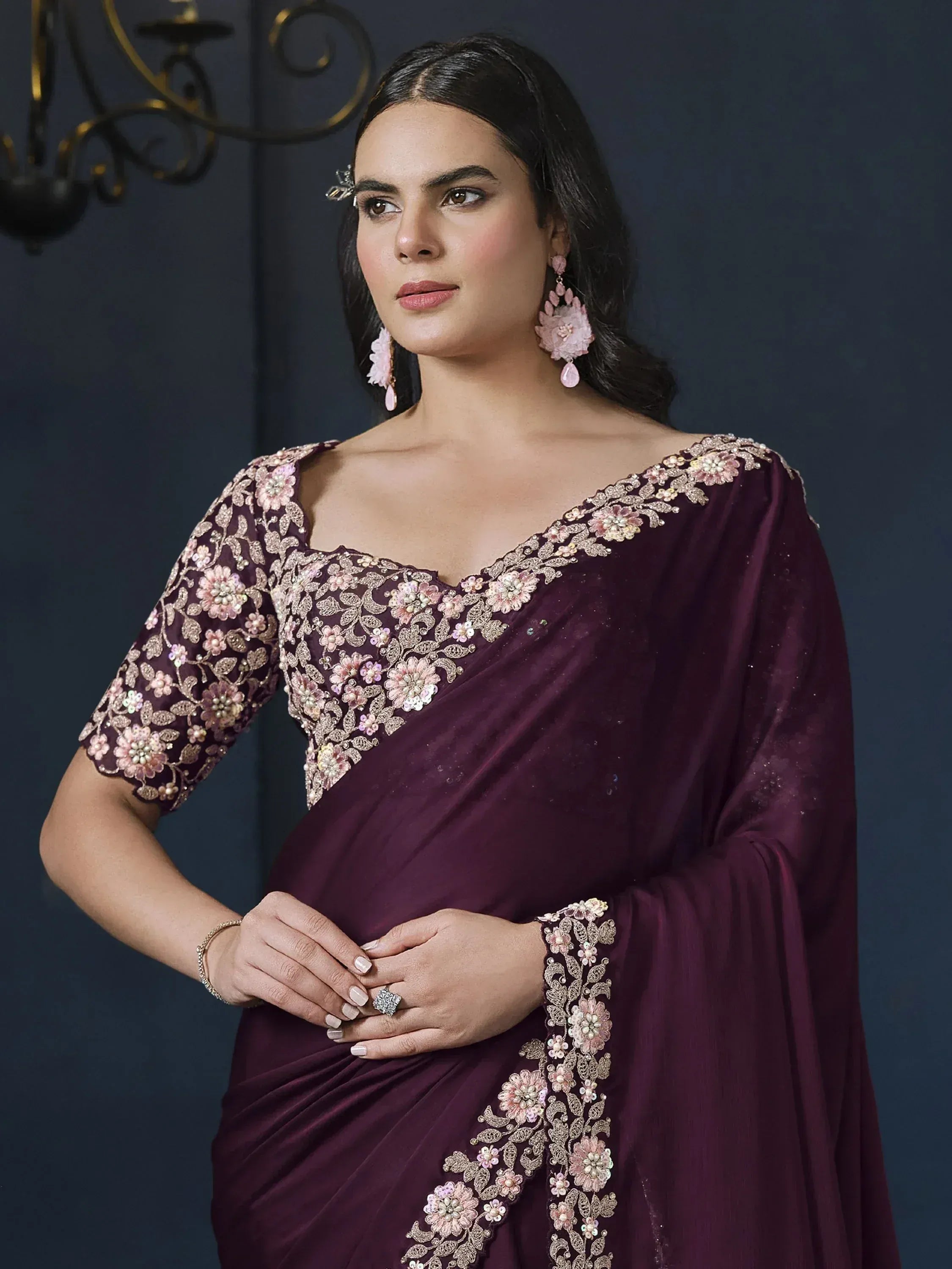 Elegant purple saree with floral embroidery, perfect for Indian ethnic wear and festive occasions.