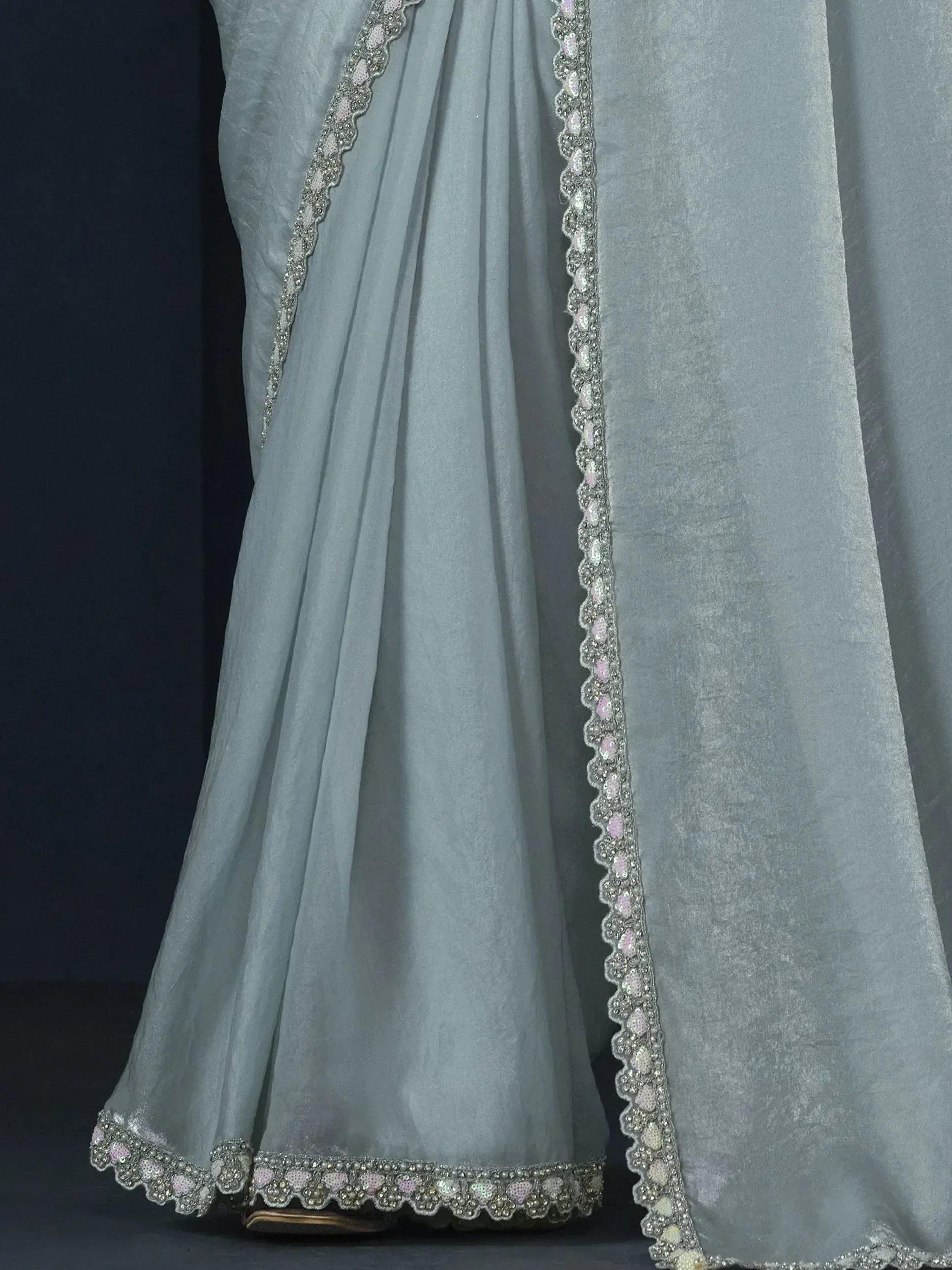 Light blue ethnic gown with scalloped sequin and bead trim, perfect for Indian festive occasions.