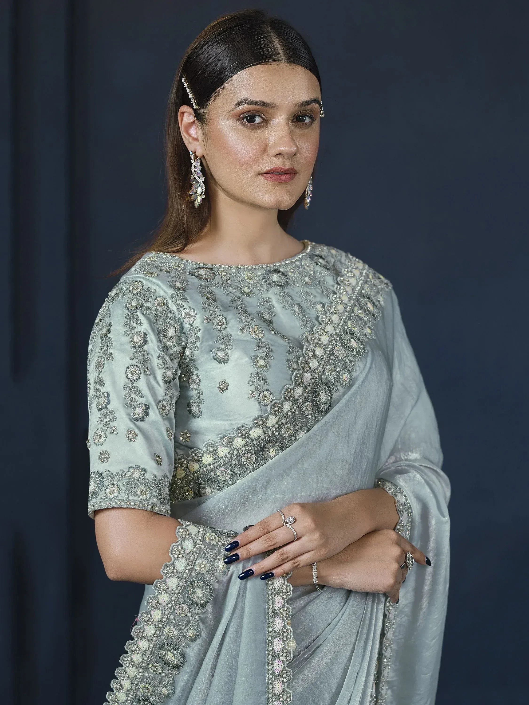 Elegant light blue embroidered saree with floral beadwork, perfect for Indian ethnic occasions