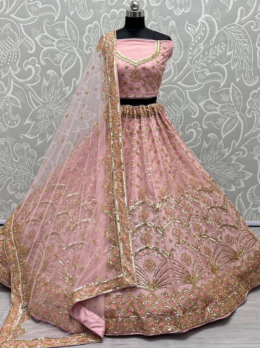 Pink designer lehenga choli with gold embroidery and matching dupatta, ethnic wear for weddings