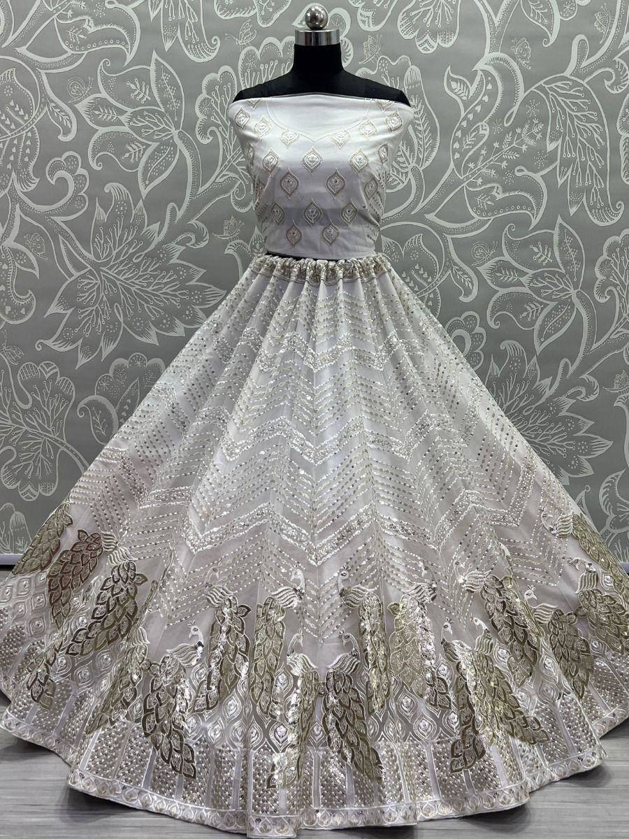 White off-shoulder ethnic gown with peacock embroidery and sequin detailing, perfect for Indian weddings