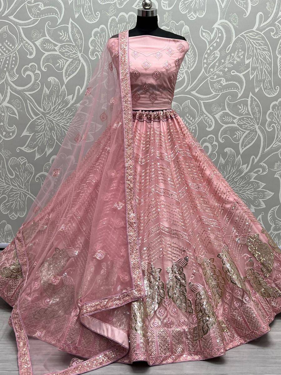 Pink designer lehenga choli with gold embroidery and peacock motifs, perfect for Indian ethnic wear occasions