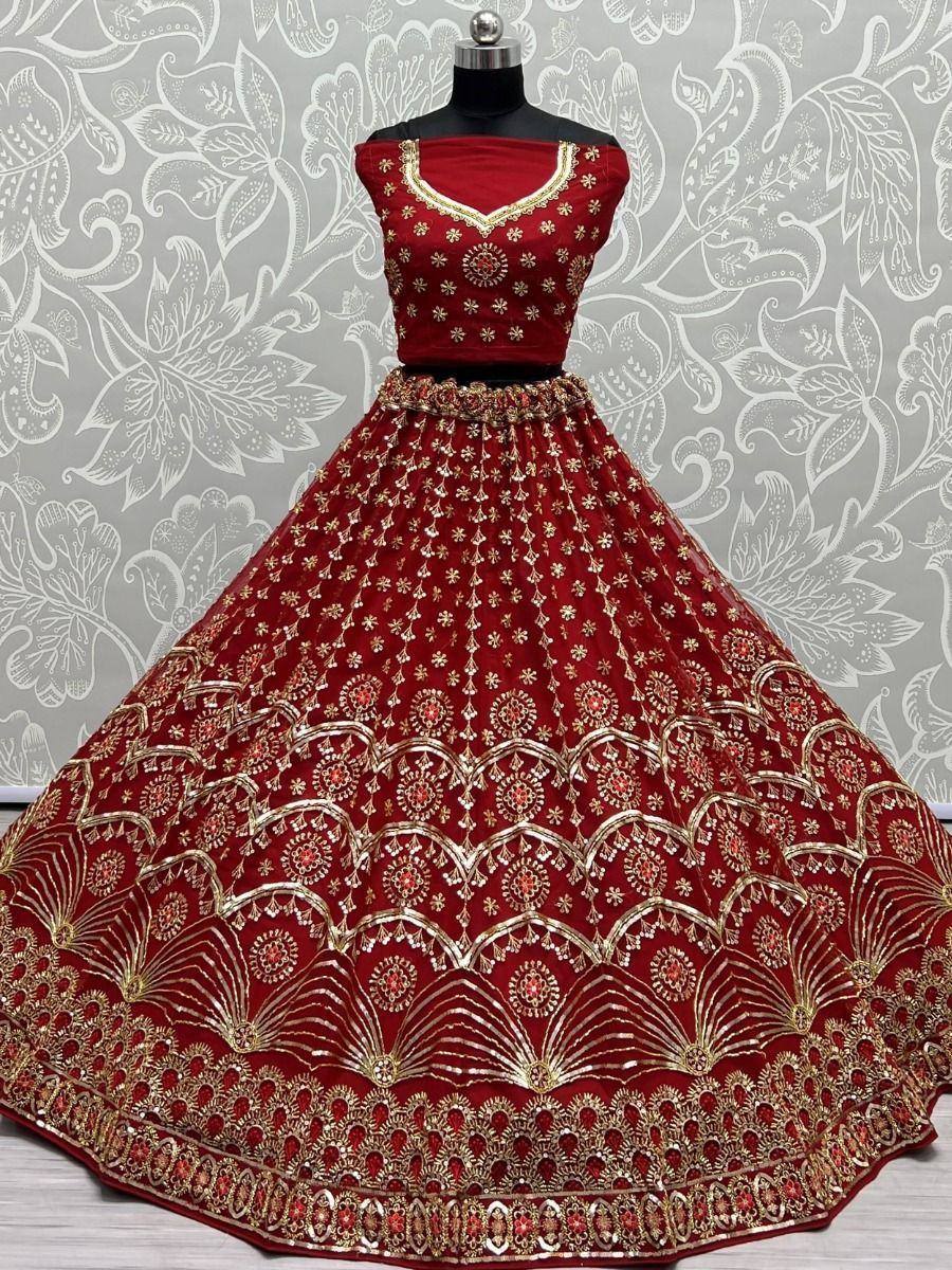 Red embroidered lehenga choli with gold detailing, perfect for Indian weddings and festive occasions