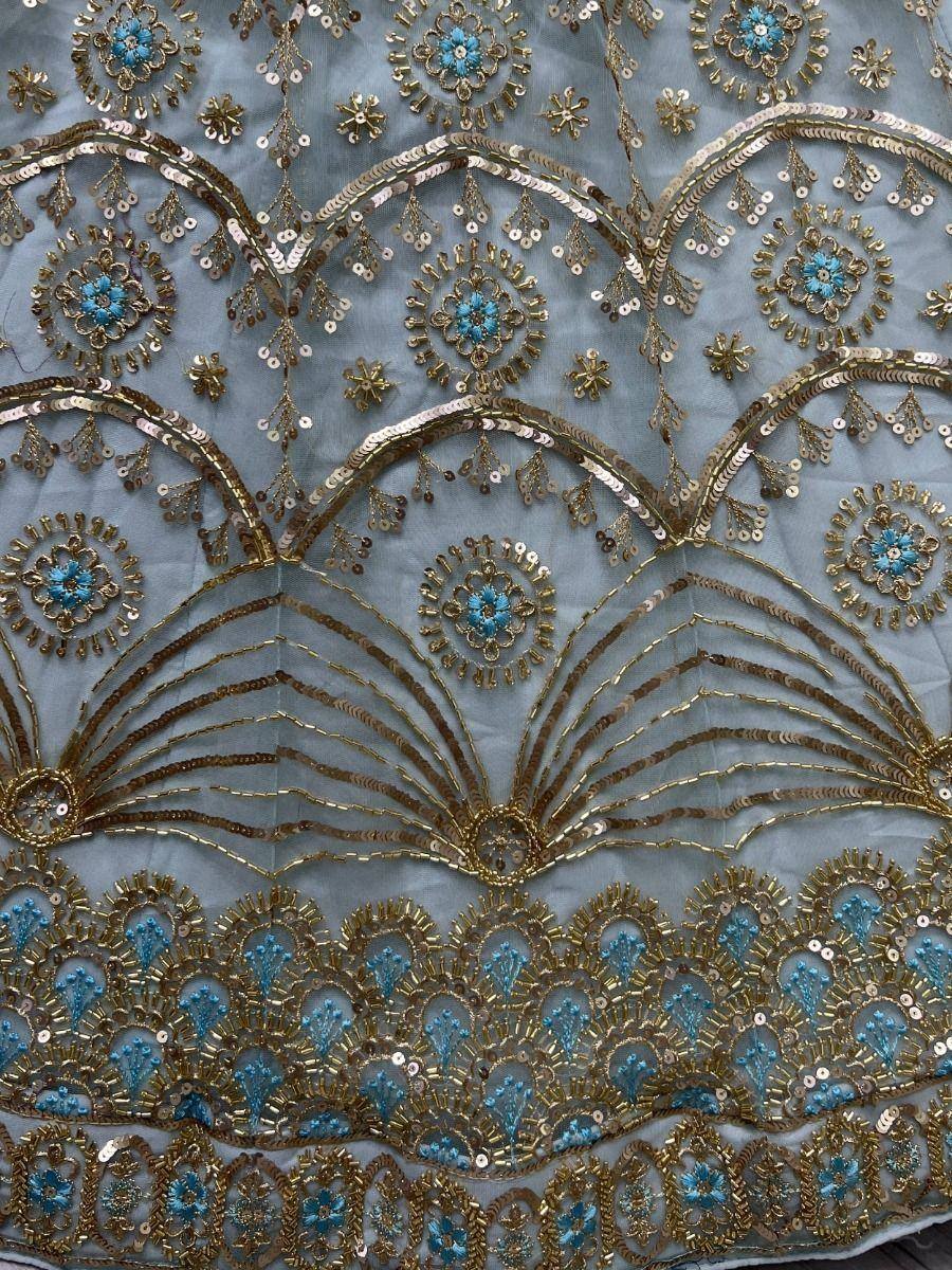 Blue and gold embroidered ethnic wear fabric with intricate floral and scalloped sequin detailing