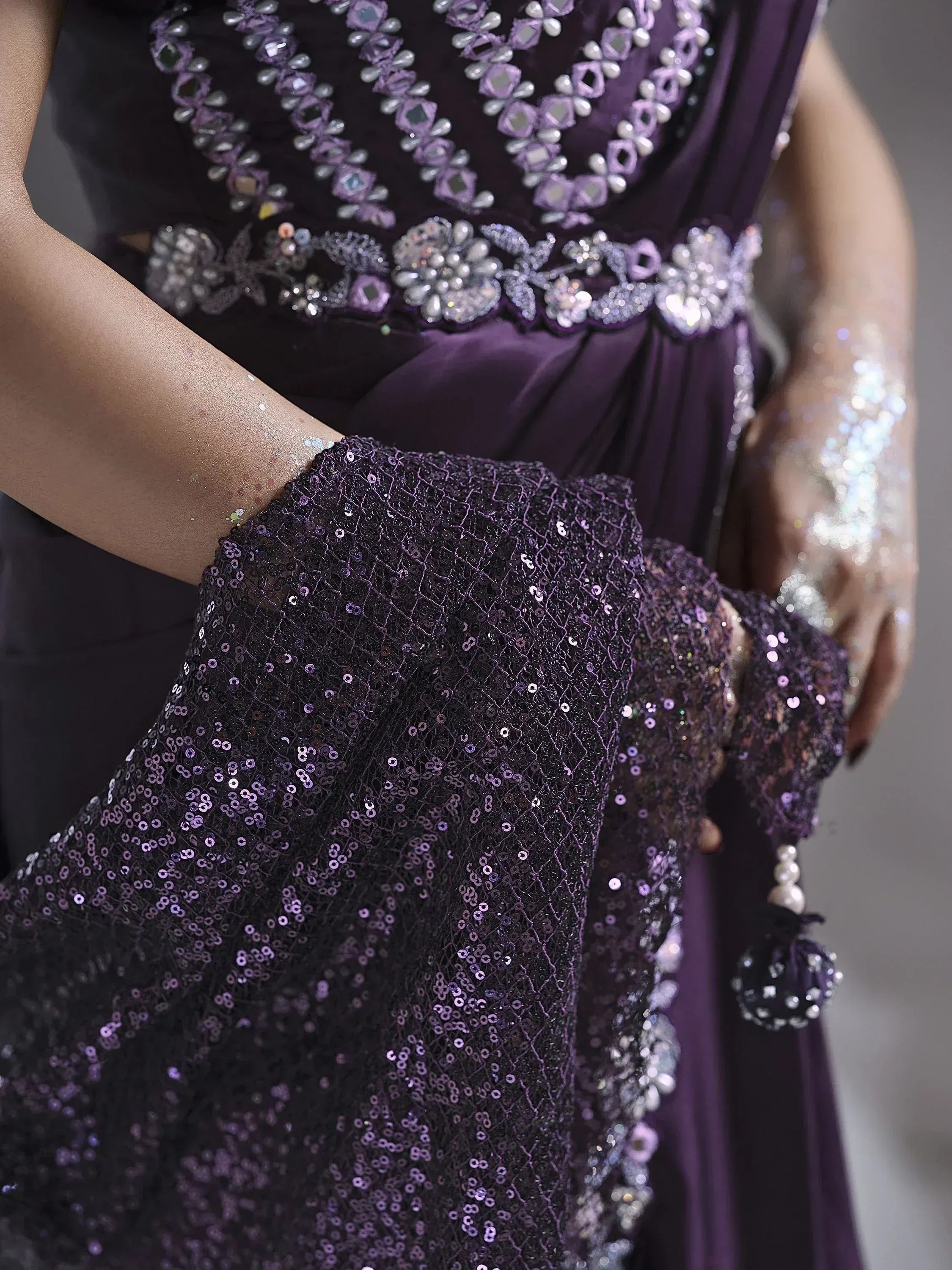 Elegant purple ethnic gown with sequin detailing and floral embellishments