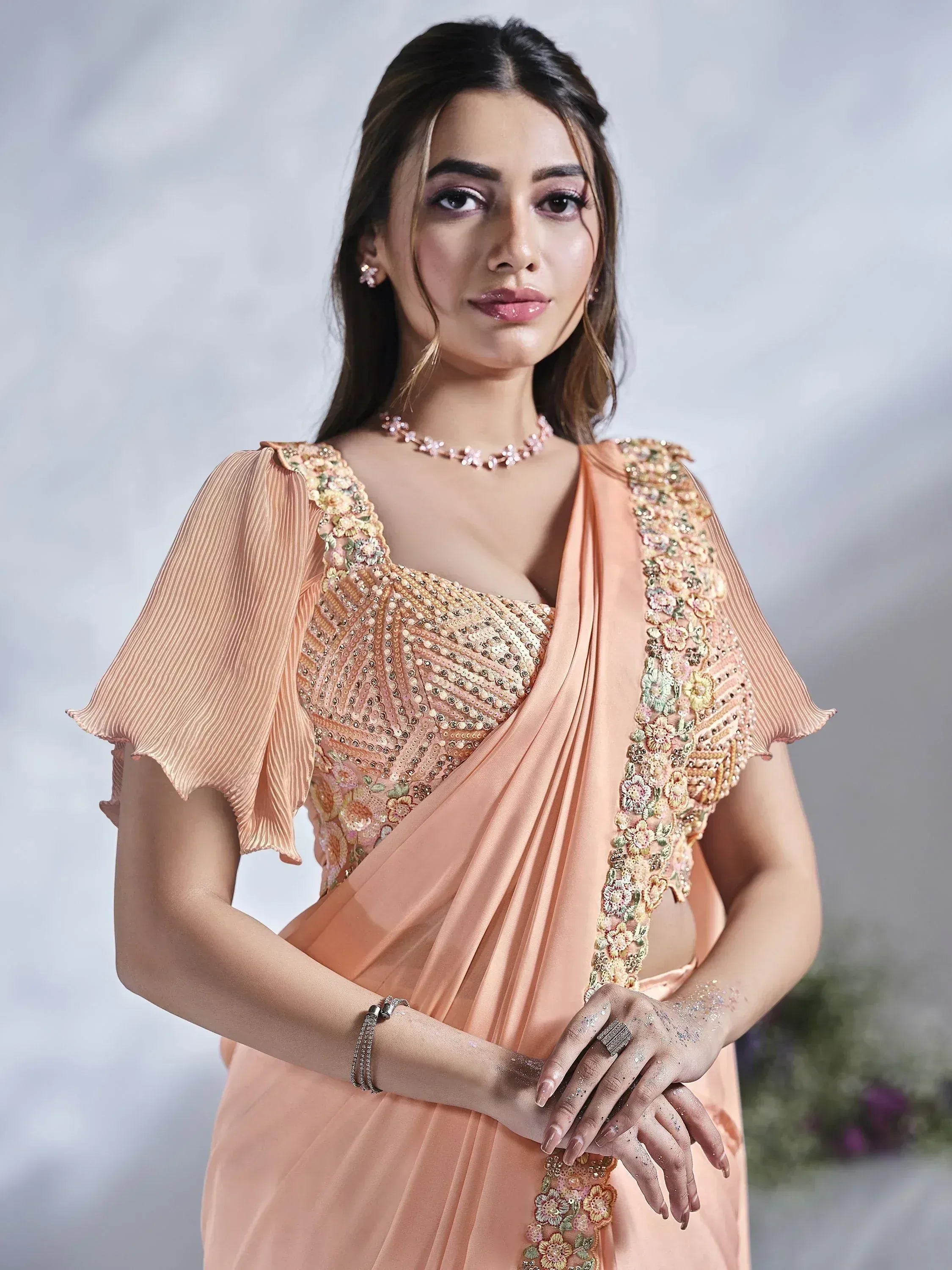Peach designer saree with floral embroidery and sequin work, perfect for Indian ethnic occasions