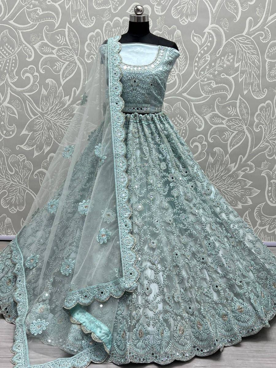 Mint green designer lehenga choli with heavy embroidery and net dupatta, perfect for weddings and parties