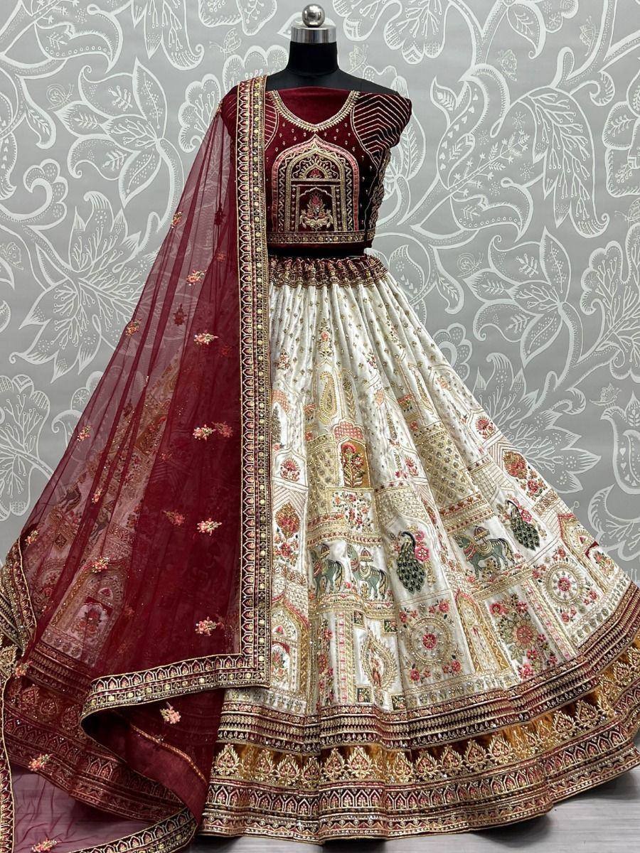 Maroon and cream designer lehenga choli with intricate embroidery and peacock motifs, perfect for weddings