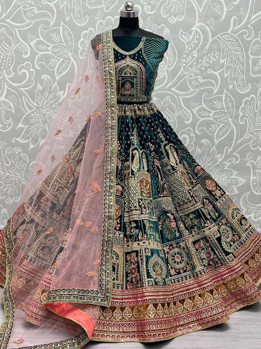 Teal designer lehenga choli with intricate gold embroidery and pink dupatta, perfect for Indian ethnic wear occasions.
