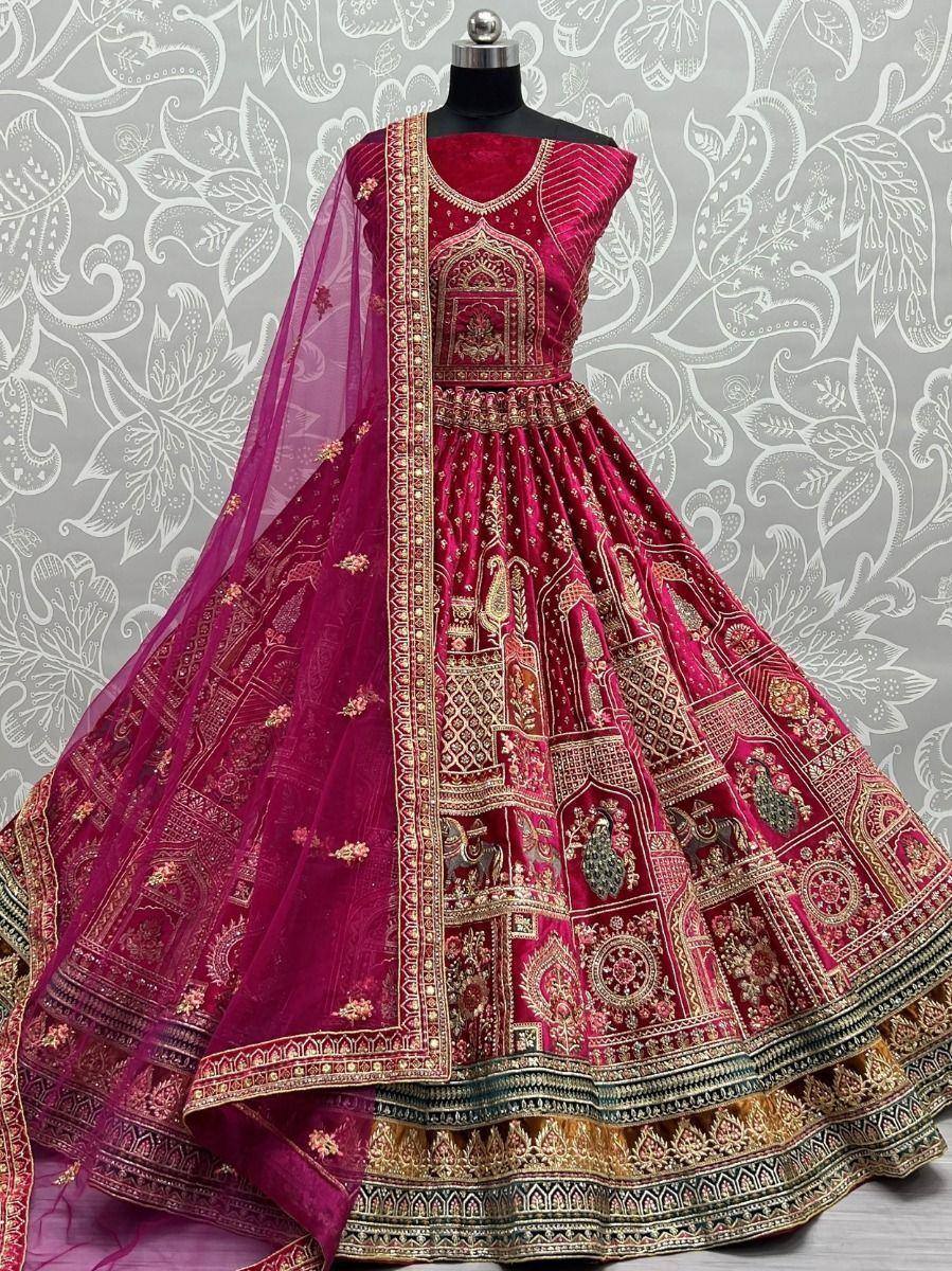 Magenta designer lehenga choli with gold embroidery and sheer dupatta, ethnic Indian wedding wear