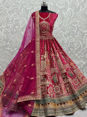 Wonderful Rani Pink Zari Embroidery Velvet Bridal Lehenga Choli