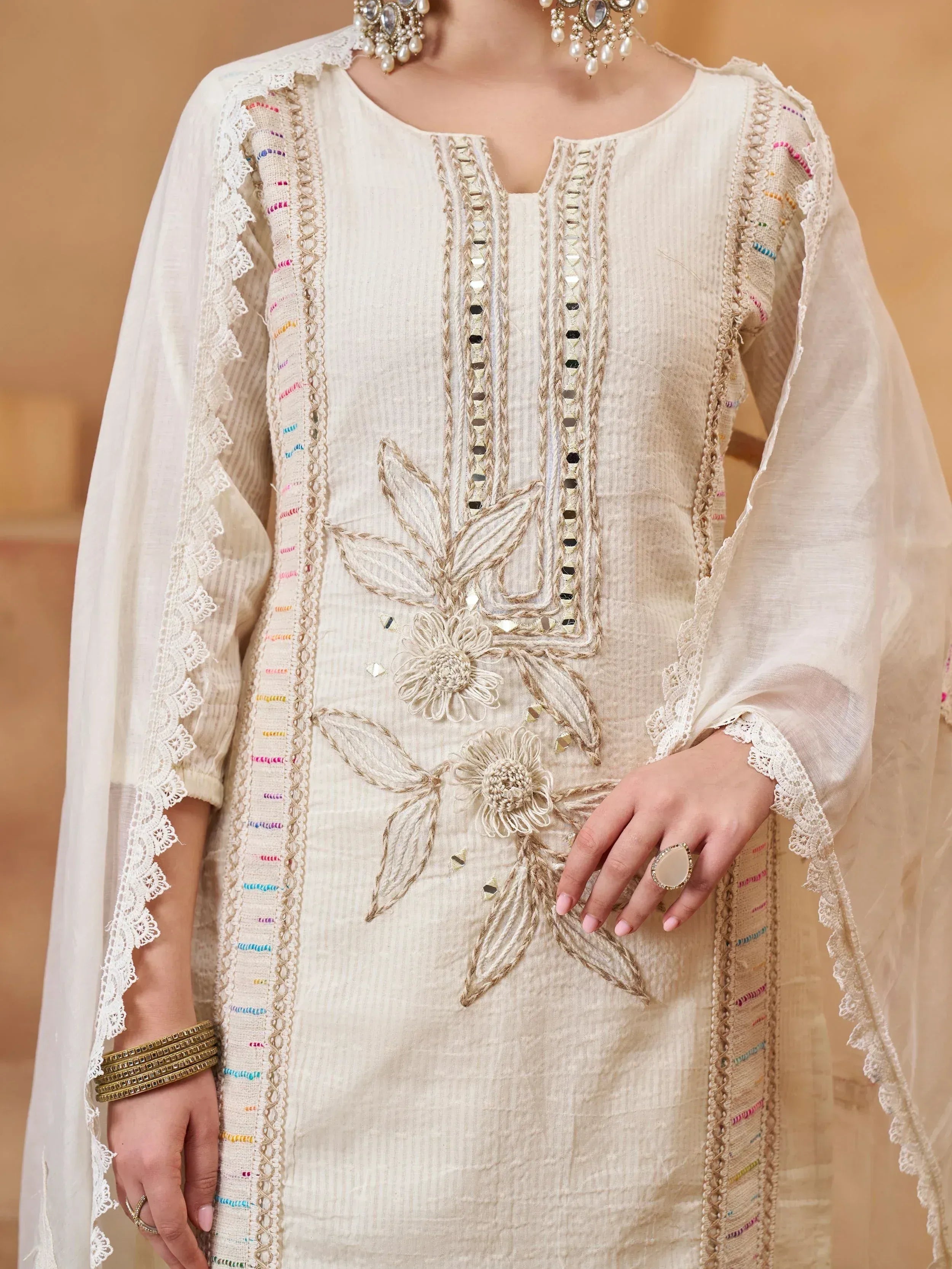 Elegant cream ethnic kurti with floral embroidery and lace sleeves, perfect for Indian wear