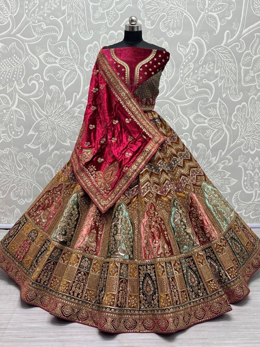 Richly embroidered maroon lehenga choli with gold detailing, perfect for Indian weddings and festive occasions.