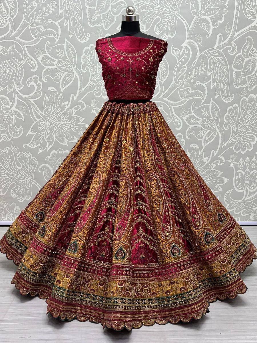 Maroon and gold embroidered lehenga choli with intricate paisley patterns, perfect for Indian ethnic wear occasions.