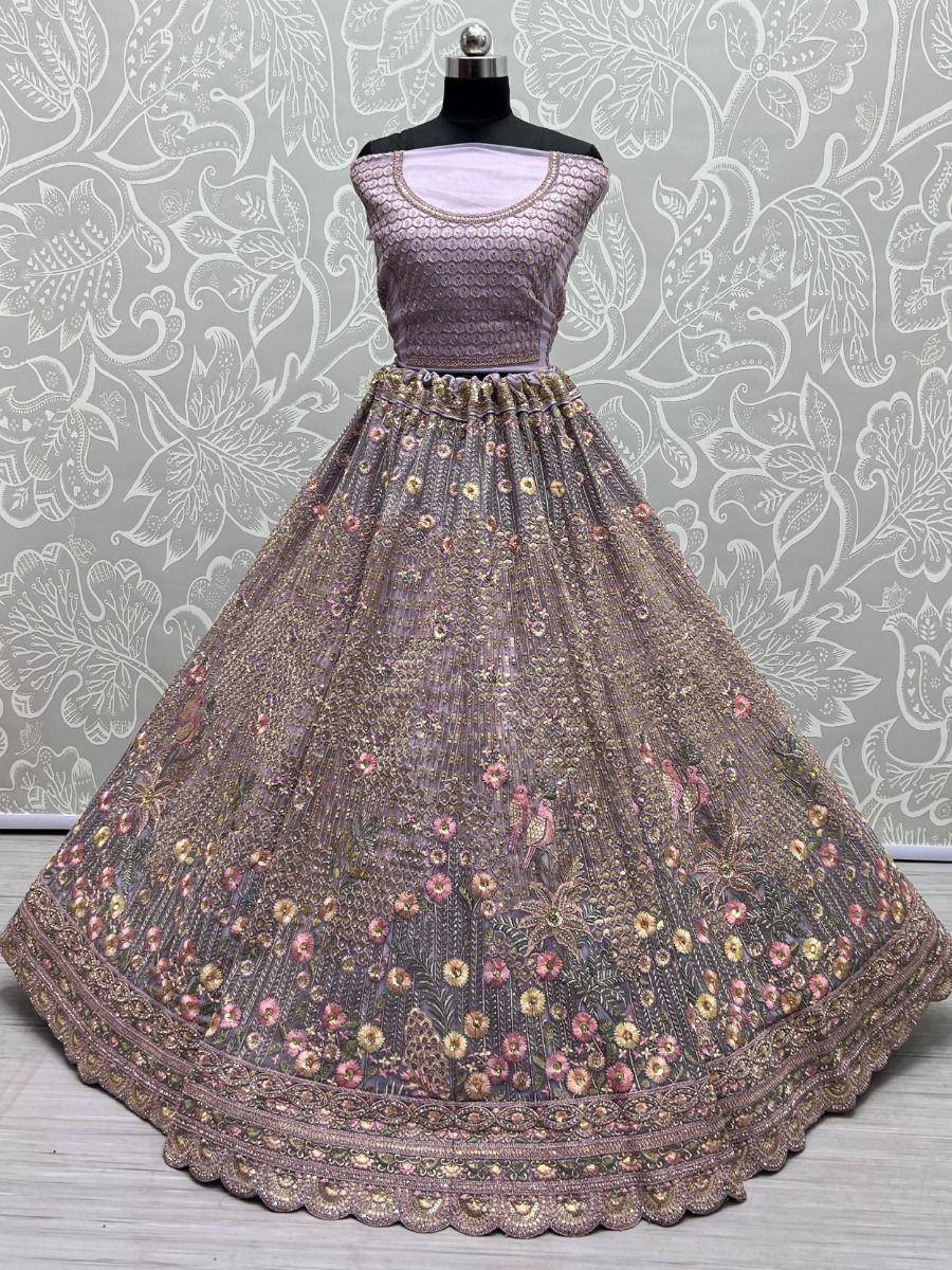 Elegant purple lehenga choli with floral embroidery and gold detailing, perfect for Indian ethnic occasions.