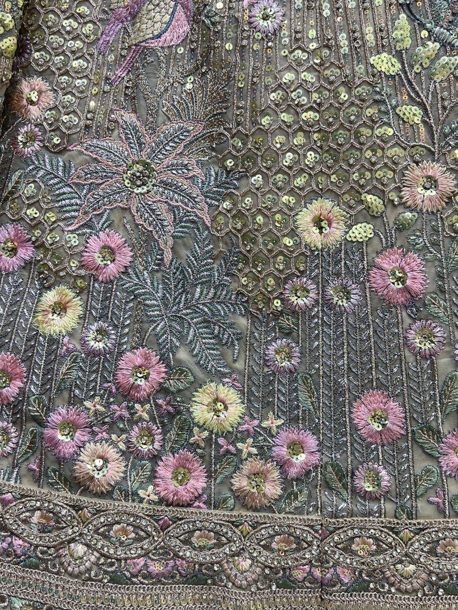 Embroidered floral lehenga fabric with sequins and pastel flowers, perfect for Indian ethnic wear