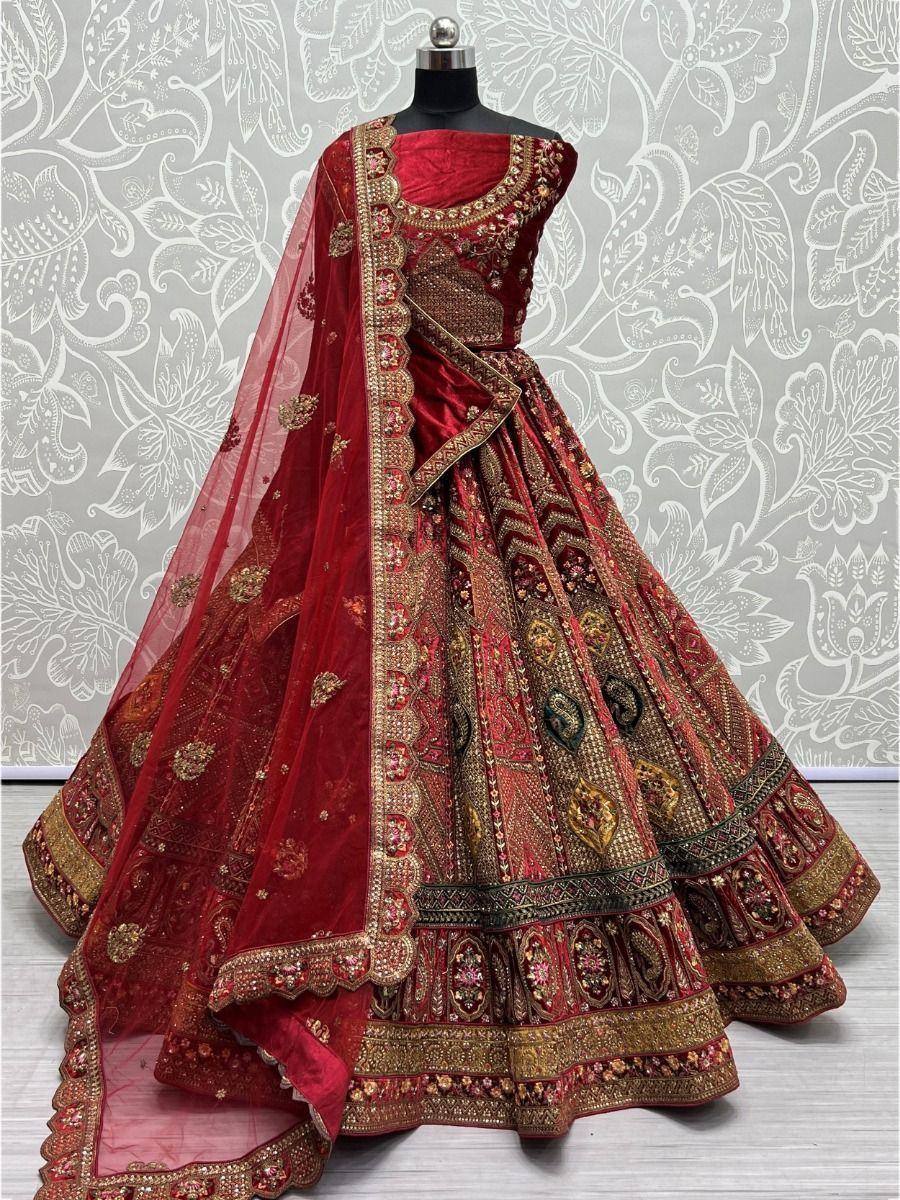 Red embroidered lehenga choli with gold detailing, perfect for Indian weddings and festive occasions