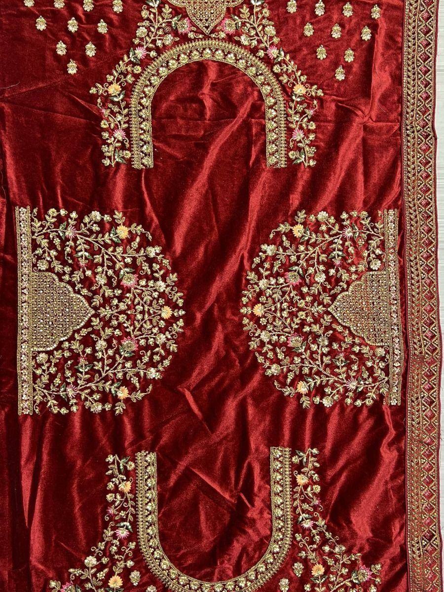 Red velvet ethnic gown with gold floral embroidery and intricate neckline design