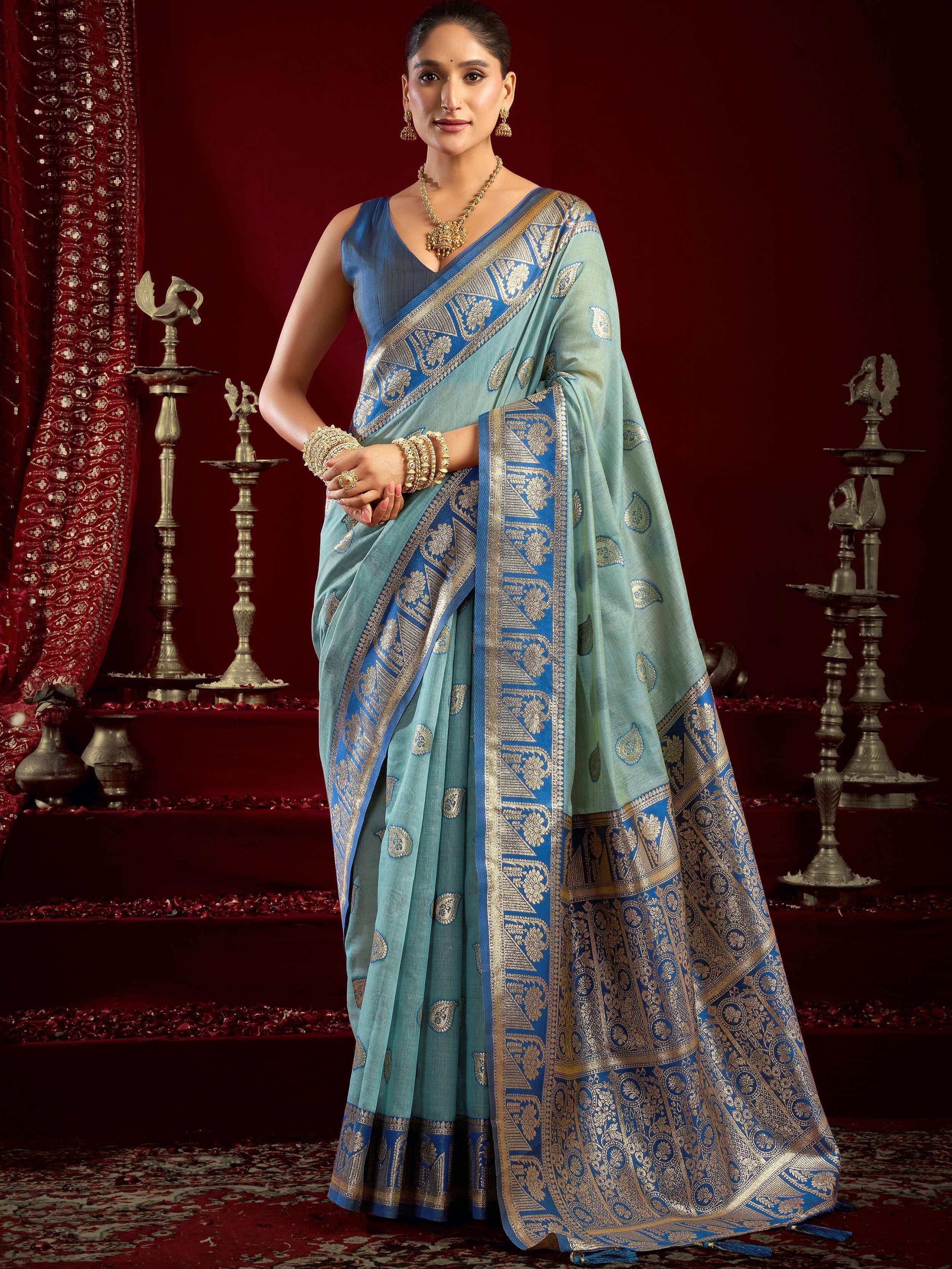 Elegant blue and gold designer saree with intricate zari work, perfect for Indian ethnic occasions