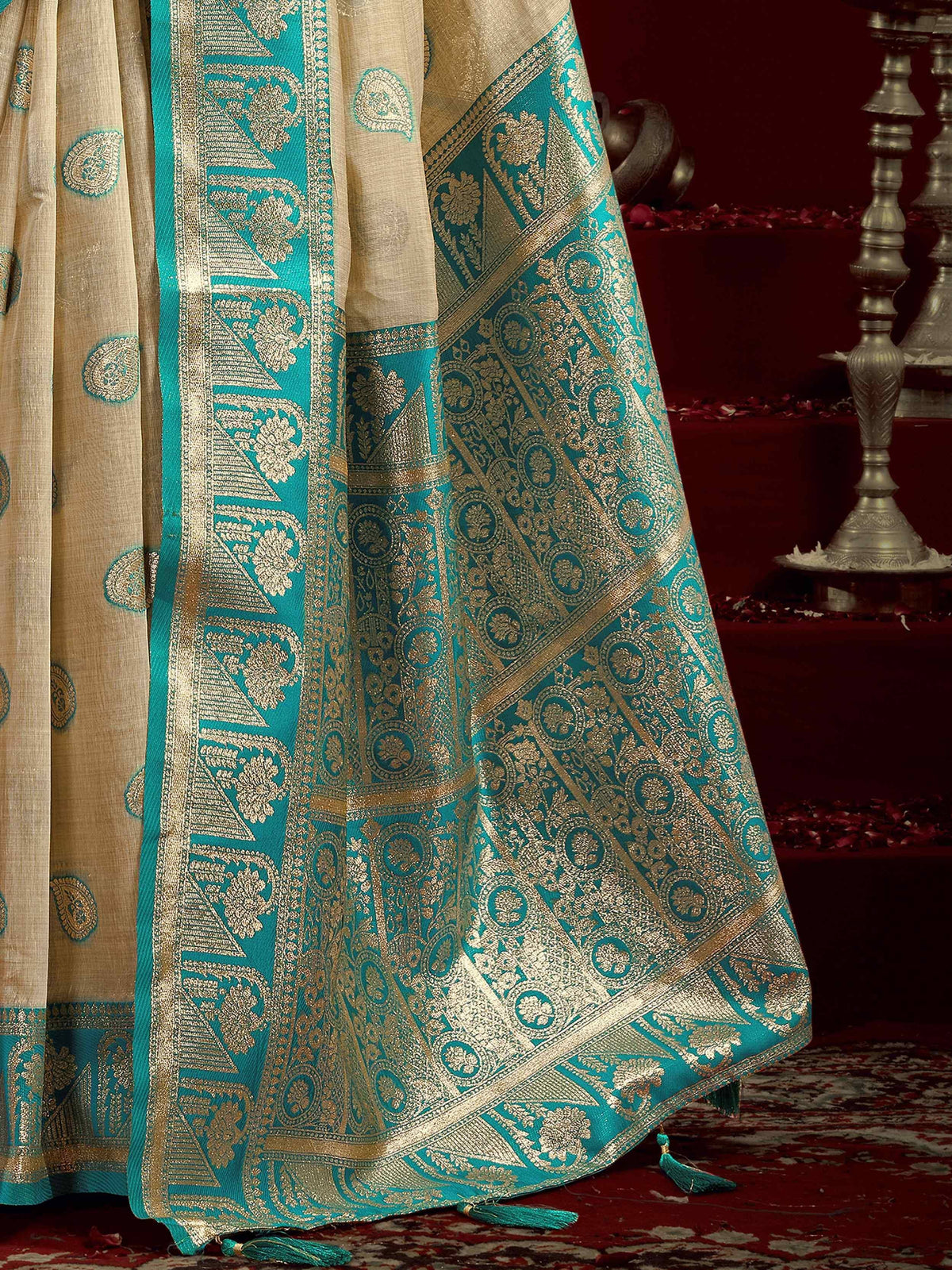 Teal and gold Banarasi saree with intricate paisley and floral motifs, perfect for Indian ethnic wear.