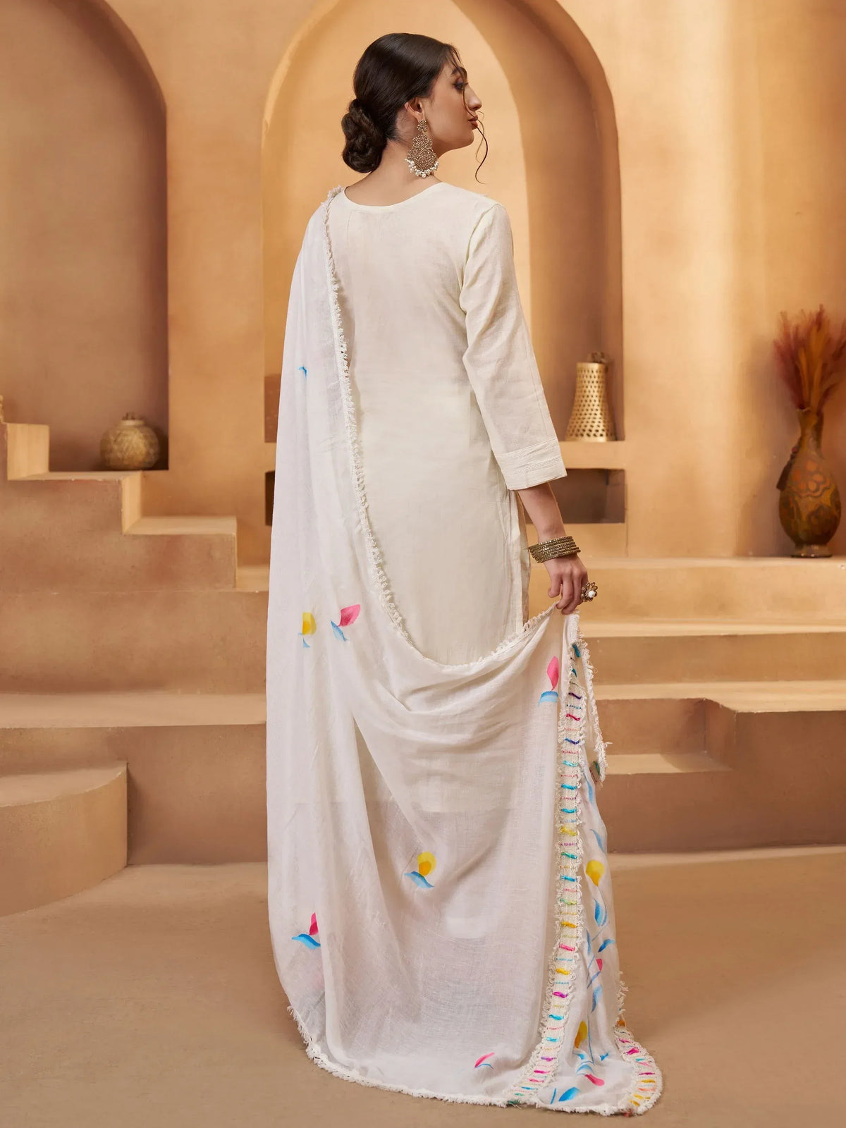 White ethnic kurta with colorful embroidered dupatta, perfect for Indian festive wear and designer occasions.