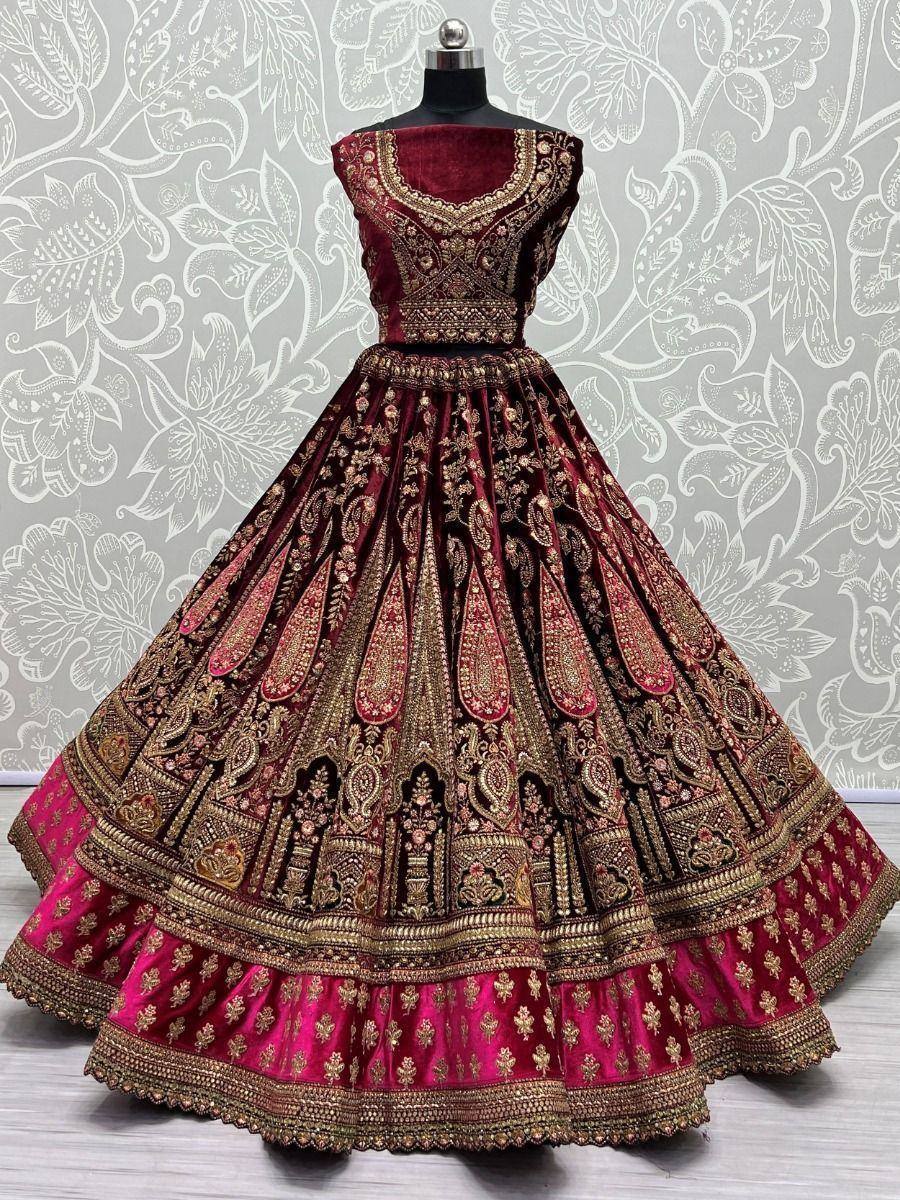 Maroon velvet lehenga choli with gold embroidery, perfect for Indian weddings and festive occasions.