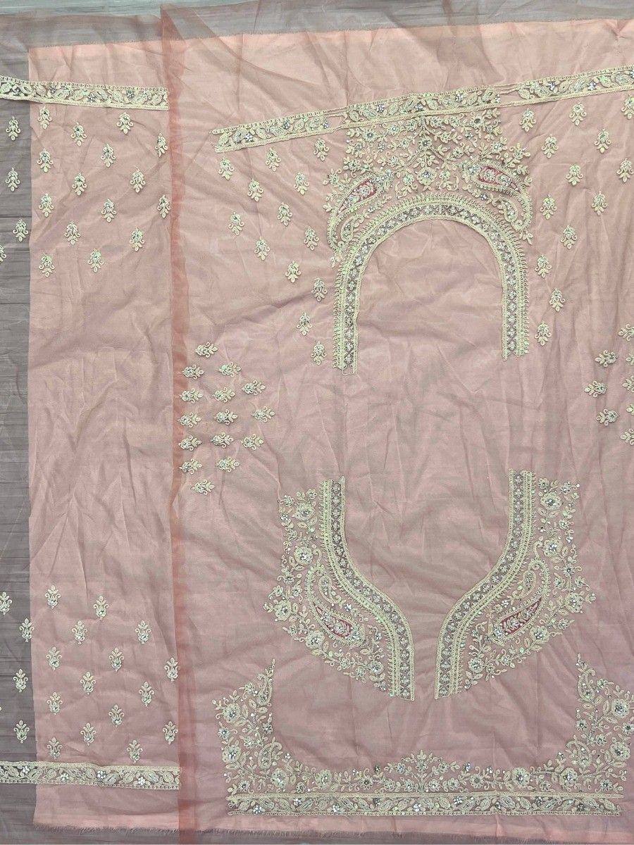 Pink embroidered designer salwar kameez with intricate neckline and sleeve detailing