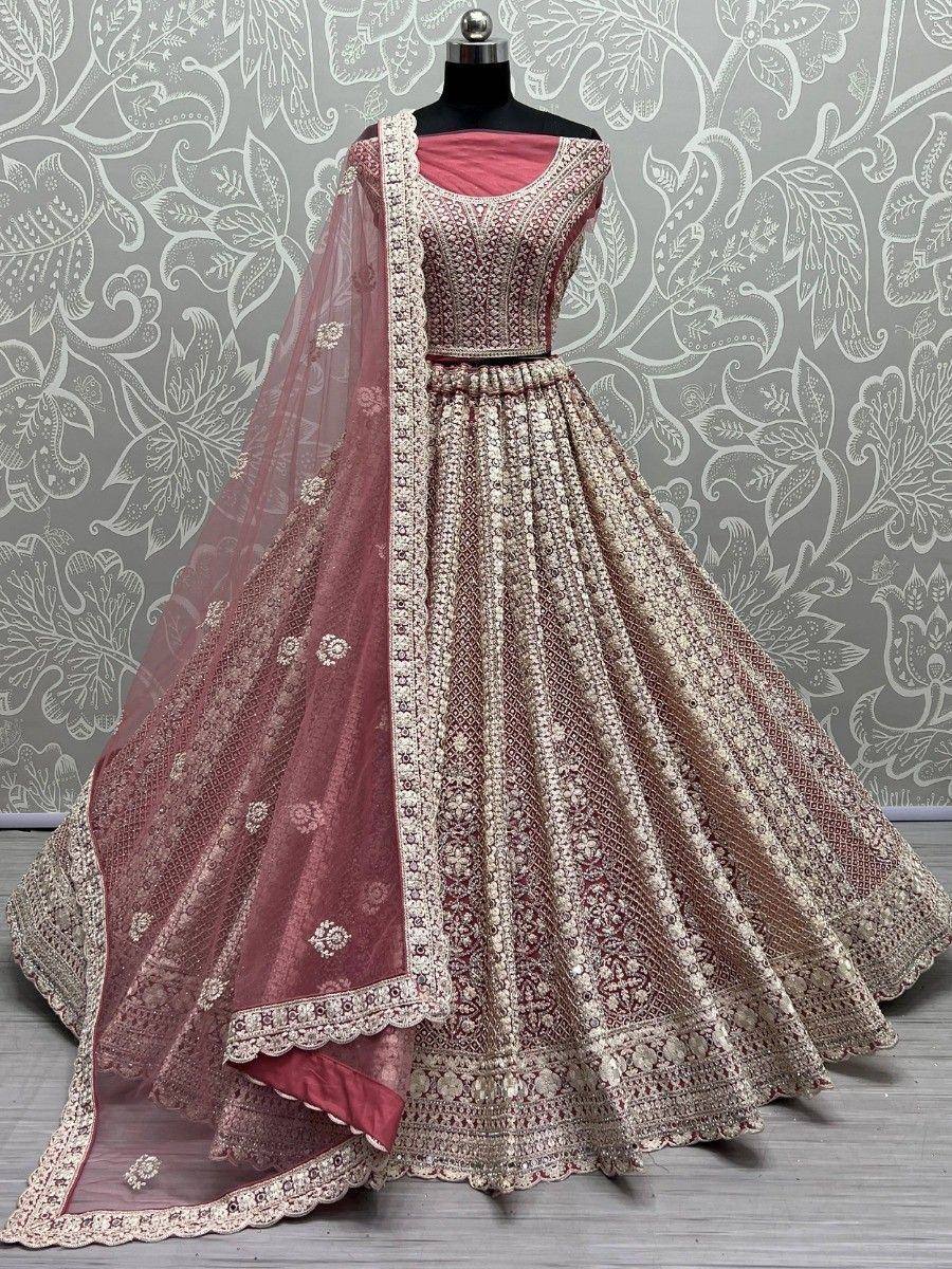 Elegant maroon lehenga choli with intricate gold embroidery and matching dupatta, perfect for Indian weddings.