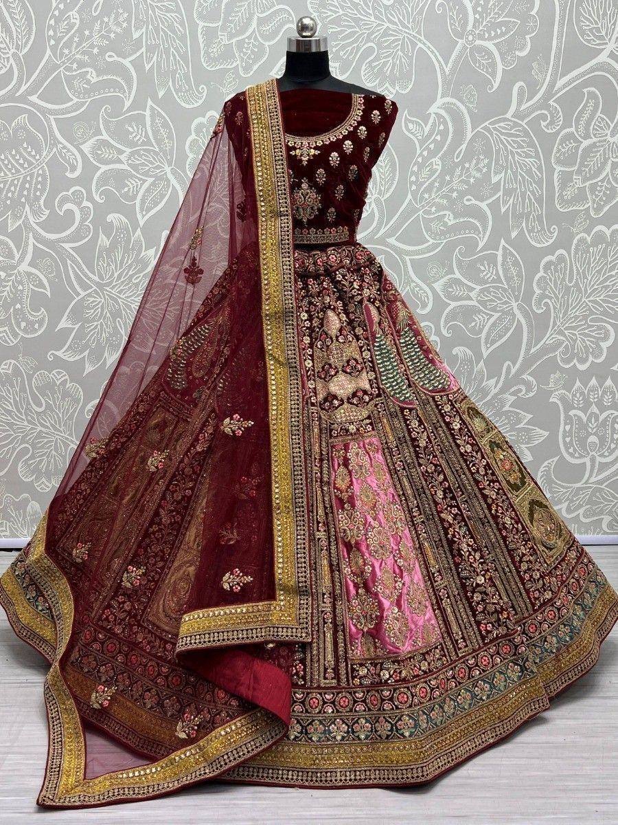 Maroon designer lehenga choli with gold embroidery and pink panel, perfect for Indian weddings and festivals
