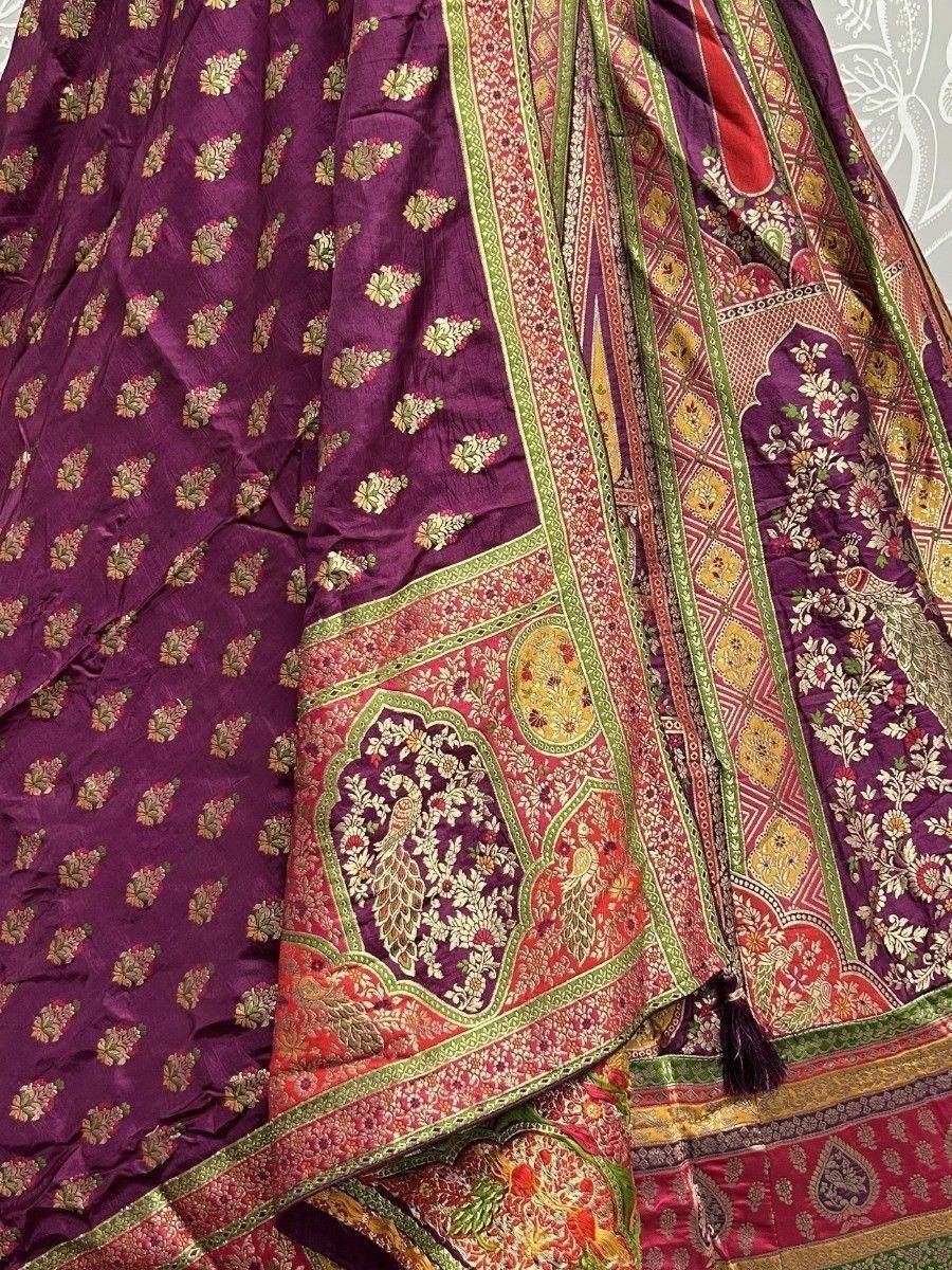 Purple ethnic lehenga with peacock and floral embroidery, traditional Indian wedding wear