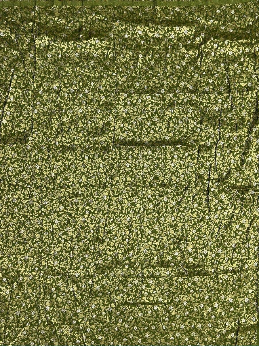 Olive green ethnic fabric with delicate floral and vine print, ideal for sarees or lehenga choli