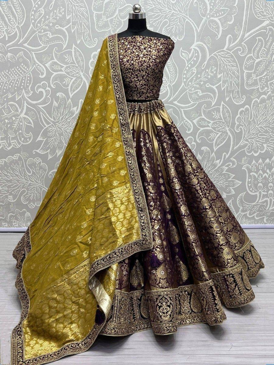 Elegant purple and gold designer lehenga choli with intricate embroidery and matching dupatta, perfect for weddings and festive occasions.