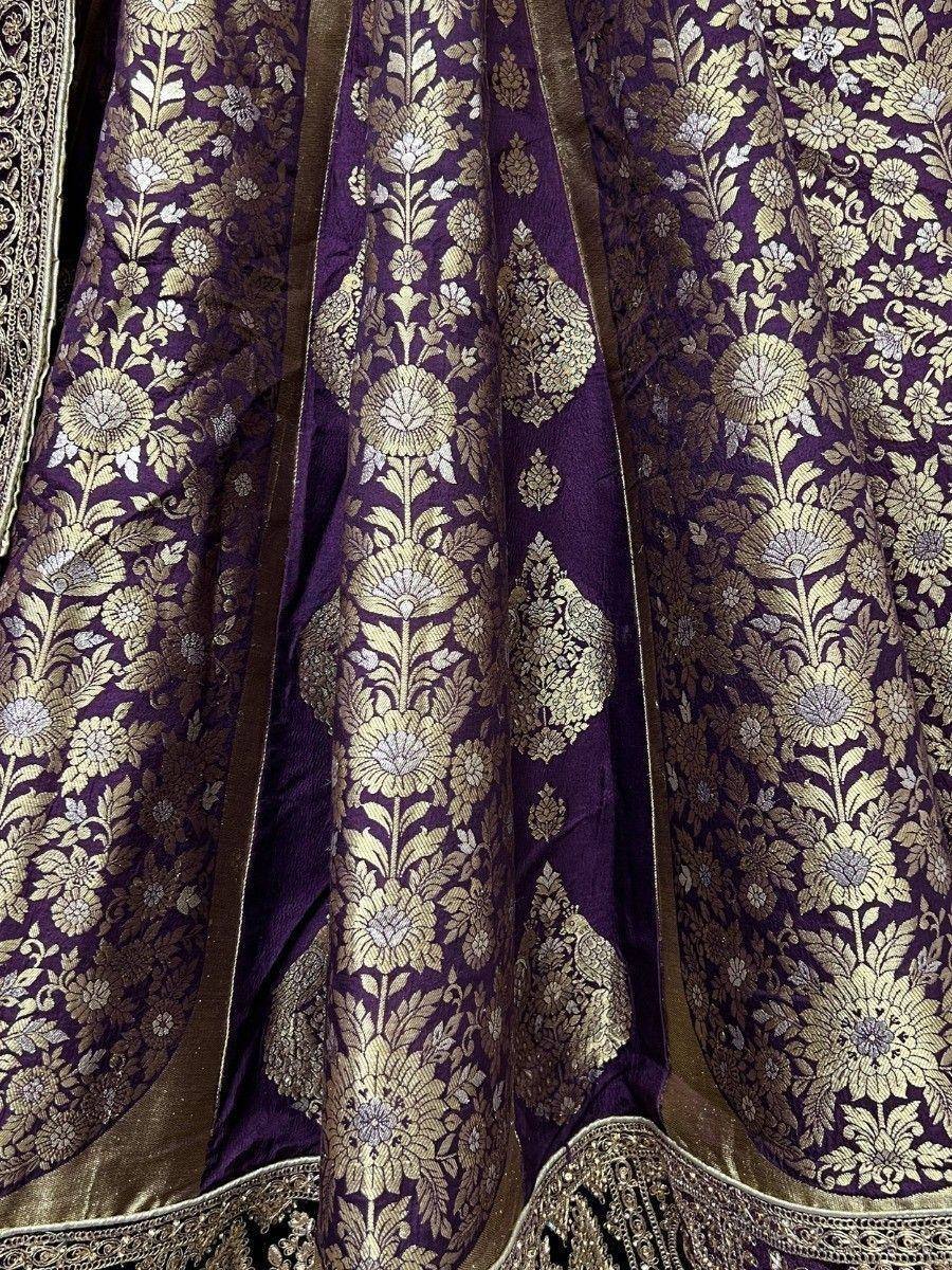 Purple and gold floral brocade lehenga with intricate embroidery and border detailing