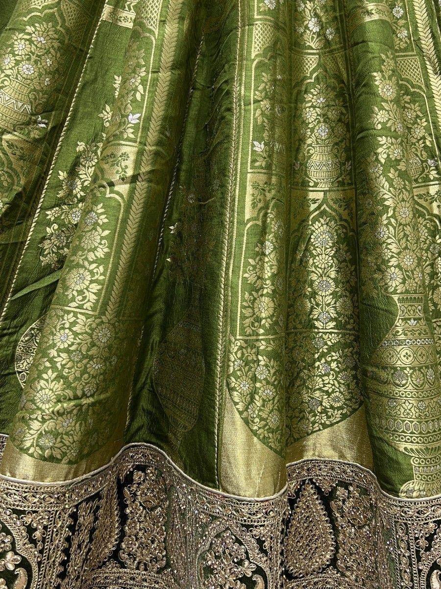 Green designer lehenga with gold floral embroidery and heavy embellished border
