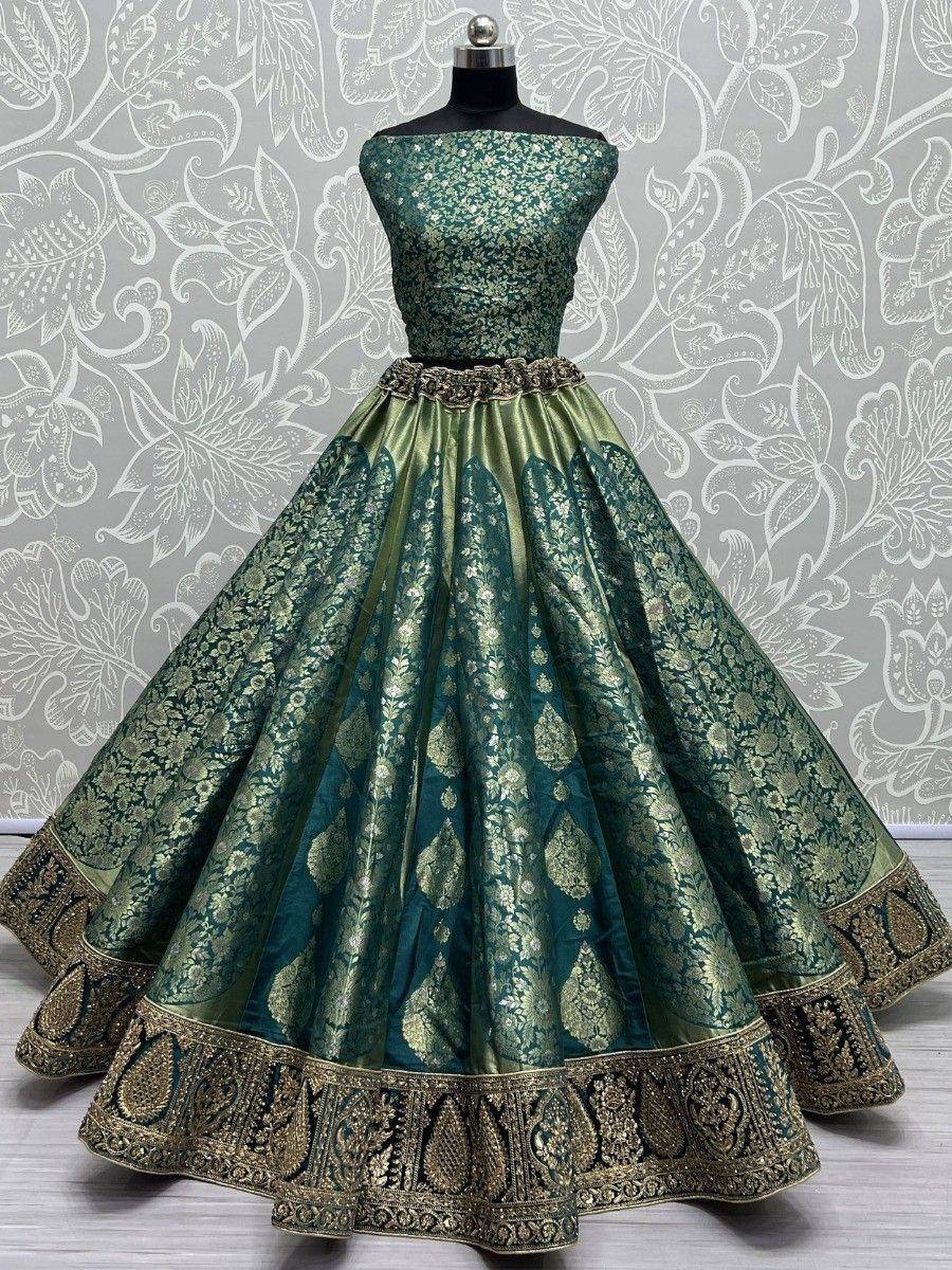 Emerald green designer lehenga choli with gold floral embroidery and heavy border, perfect for Indian weddings