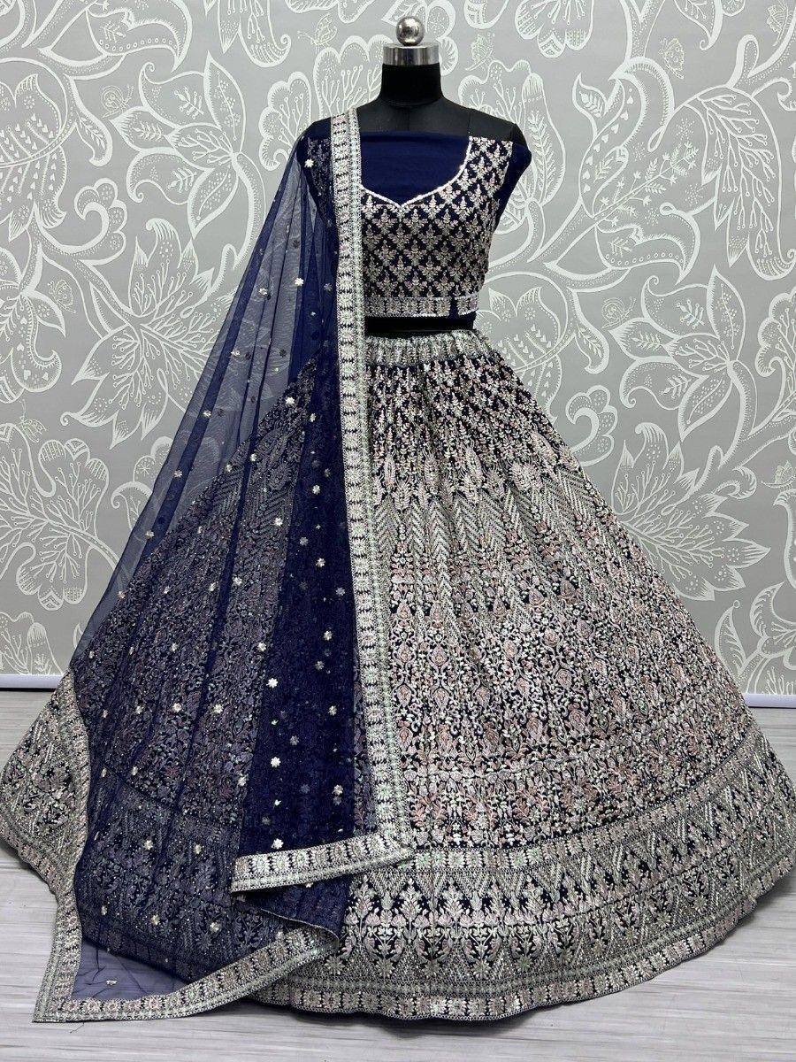Navy blue and silver embroidered lehenga choli with dupatta, perfect for Indian weddings and festive occasions.
