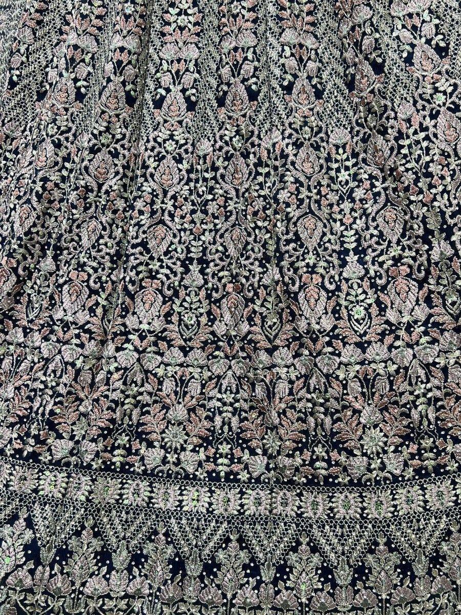 Black ethnic wear fabric with intricate floral embroidery and zari work, perfect for designer lehenga or saree.