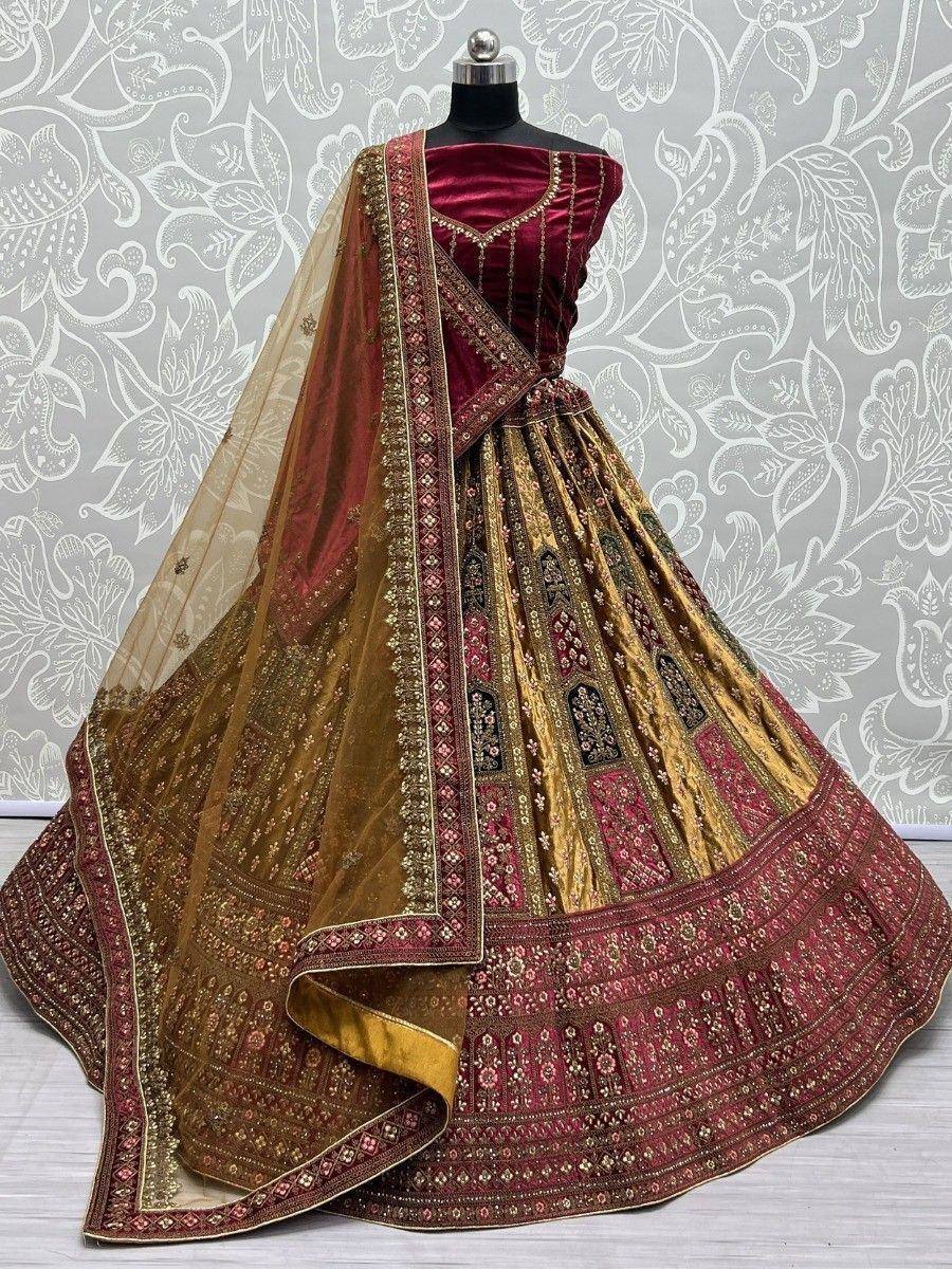 Maroon and gold designer lehenga choli with intricate embroidery and sheer dupatta, perfect for weddings