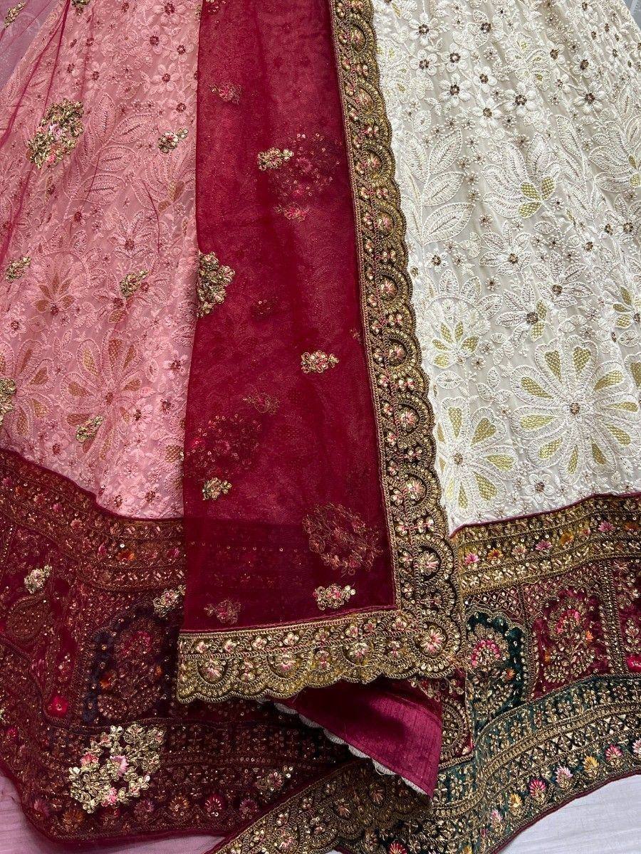Luxury Indian lehenga choli with intricate embroidery in pink, maroon, and white, perfect for weddings and festivals.
