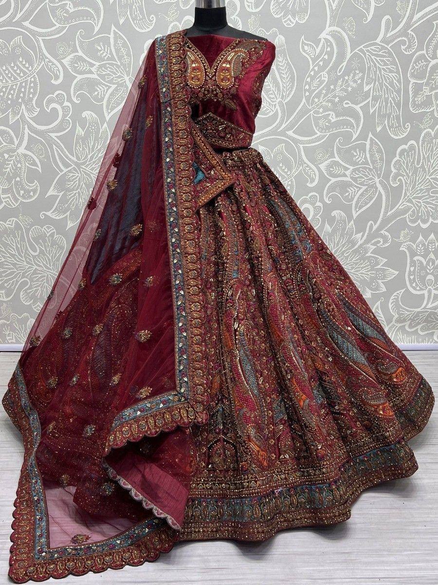 Maroon designer lehenga choli with heavy embroidery and net dupatta, perfect for weddings and festive occasions