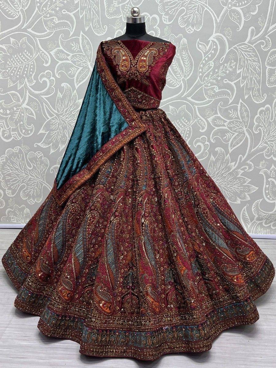 Maroon velvet lehenga choli with teal dupatta, heavy embroidery, paisley design for Indian weddings