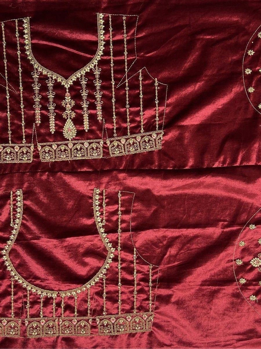 Maroon velvet lehenga choli with gold embroidery and dangling motifs, ideal for Indian ethnic wear