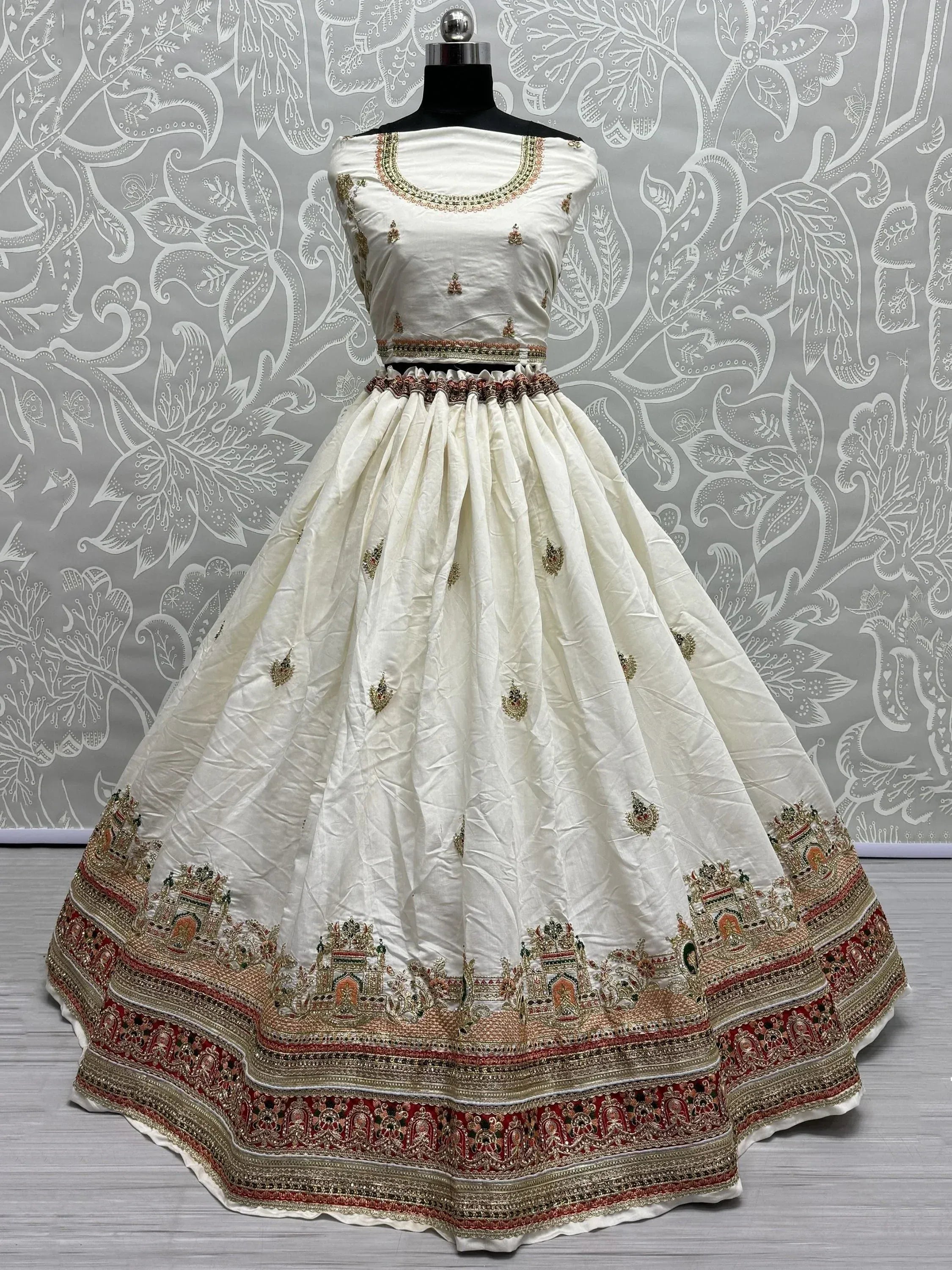 White embroidered lehenga choli with red gold border, Indian ethnic wear for weddings and festivals