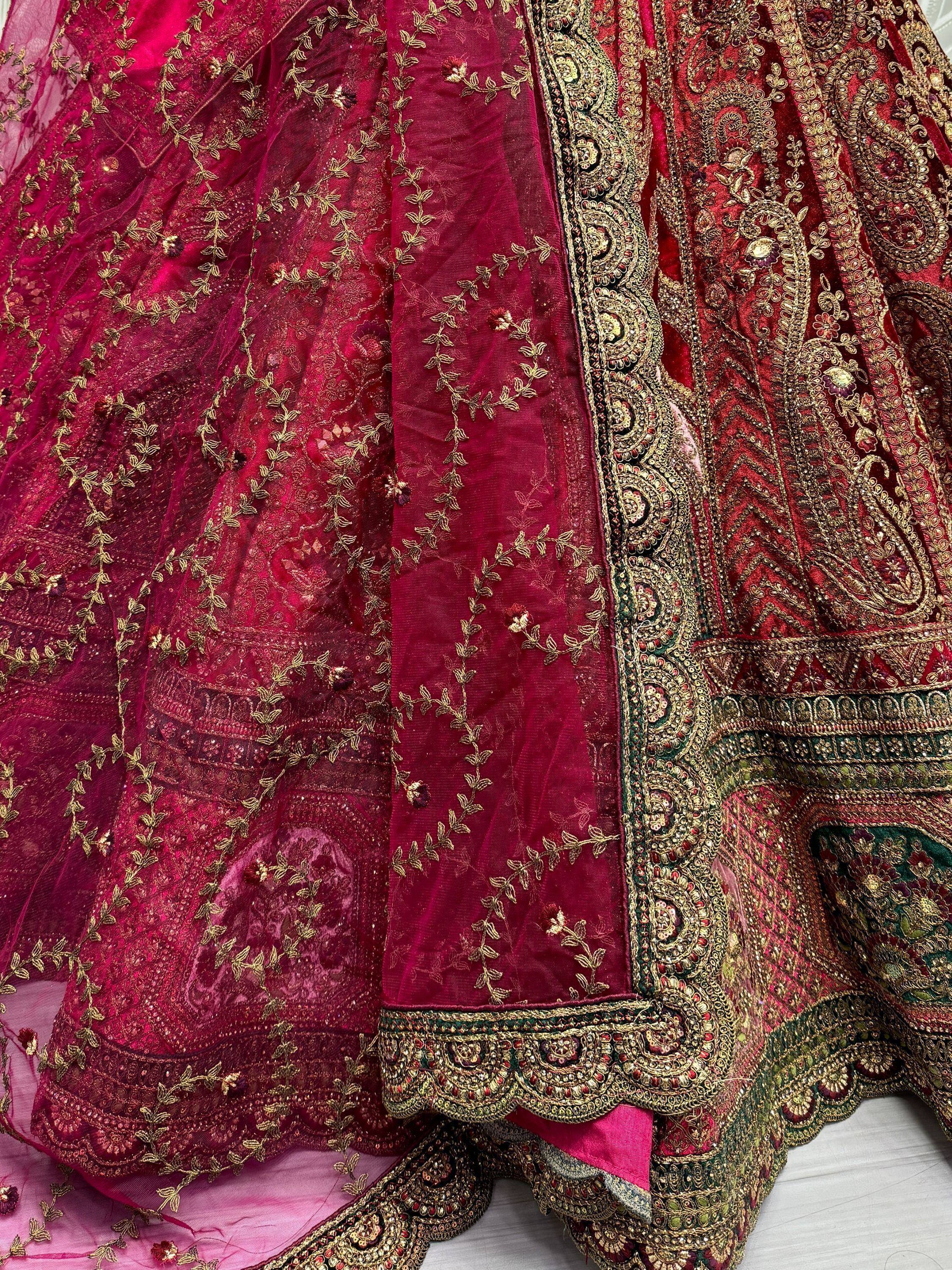 Luxury maroon lehenga choli with gold embroidery and intricate paisley detailing for Indian ethnic wear