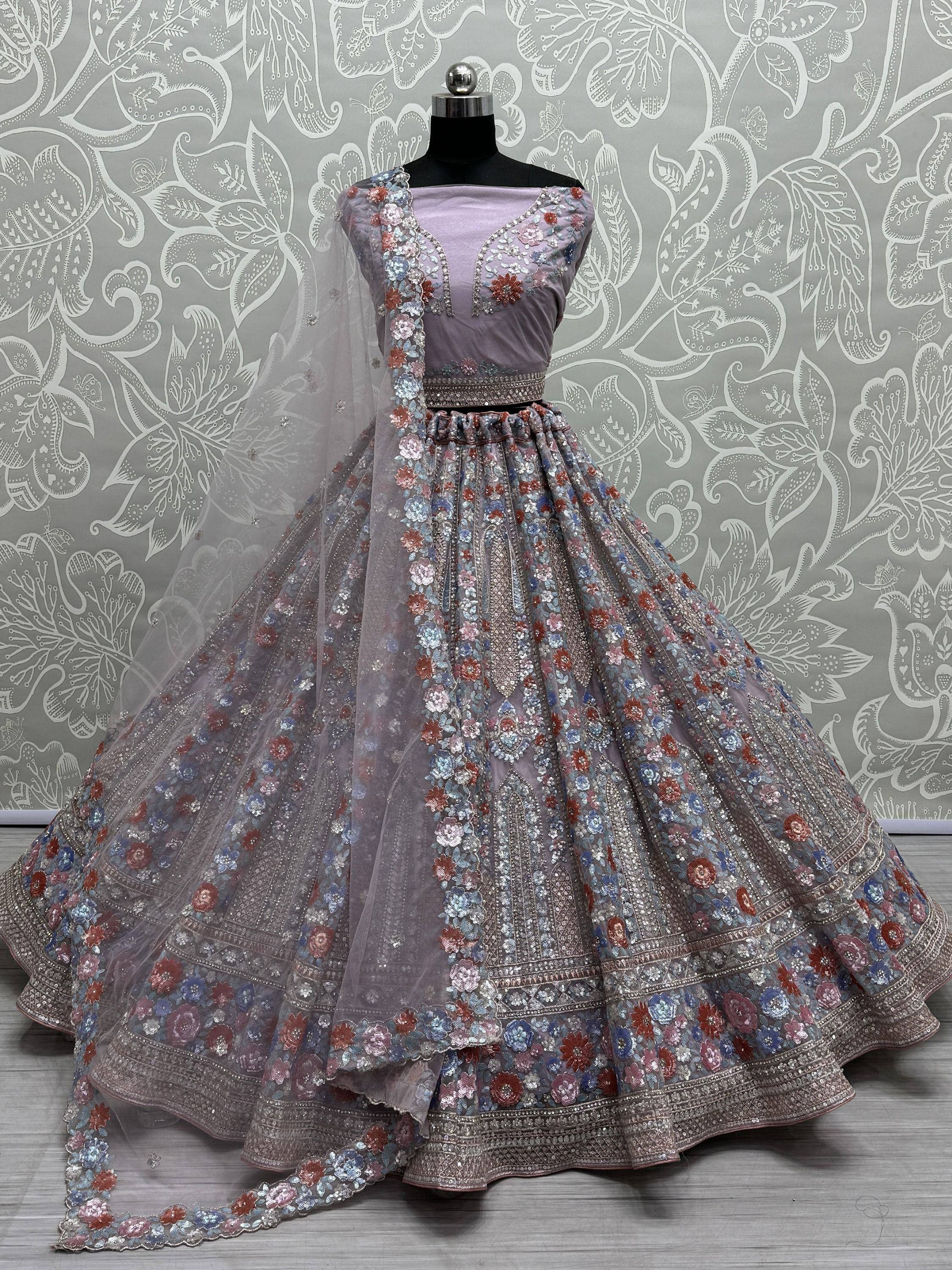 Lavender designer lehenga choli with floral embroidery and sequins, perfect for Indian weddings and parties.