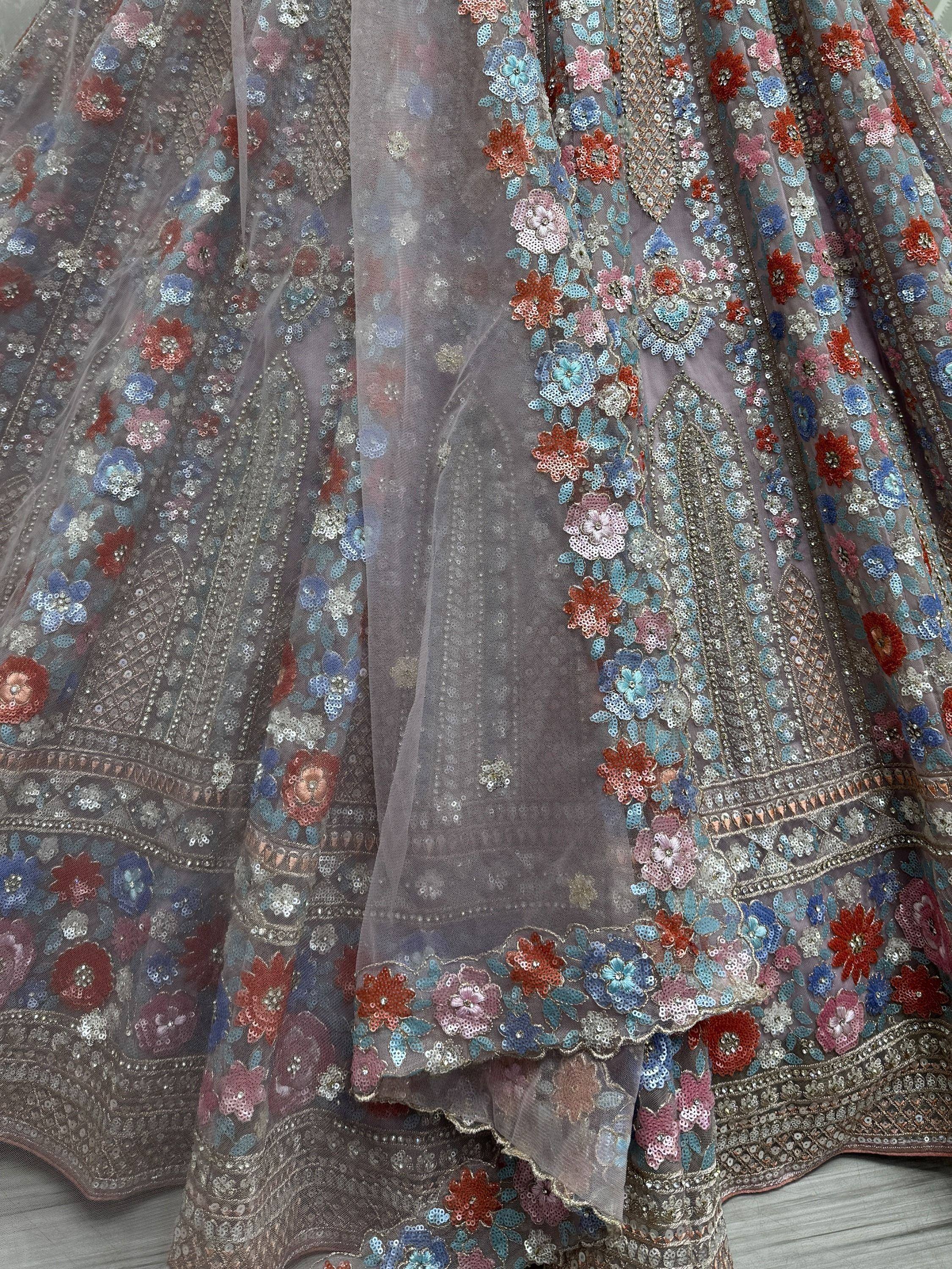 Designer lehenga with floral sequin embroidery in pastel shades, perfect for Indian ethnic wear