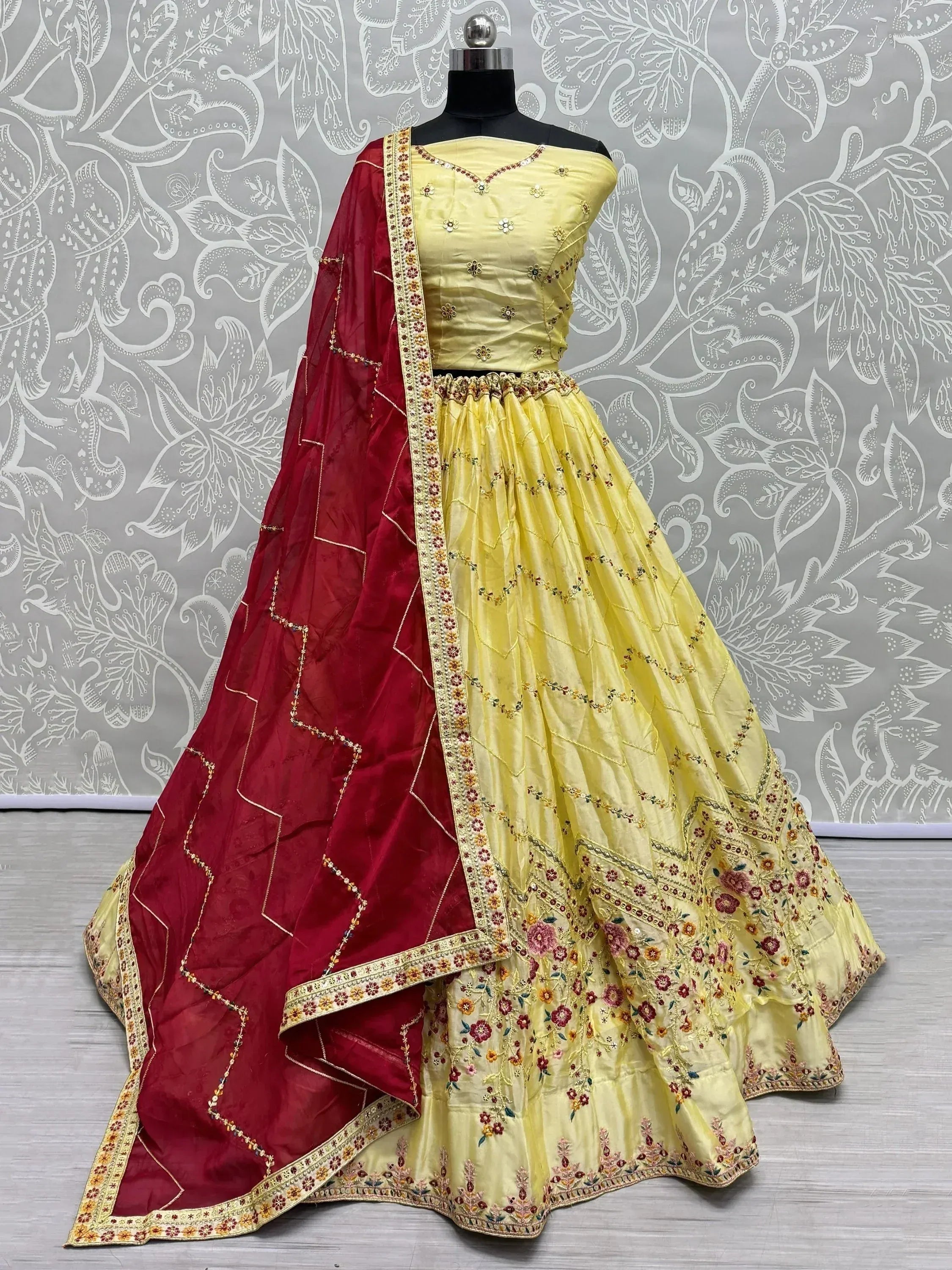 Yellow embroidered lehenga choli with red dupatta, designer Indian ethnic wear for women