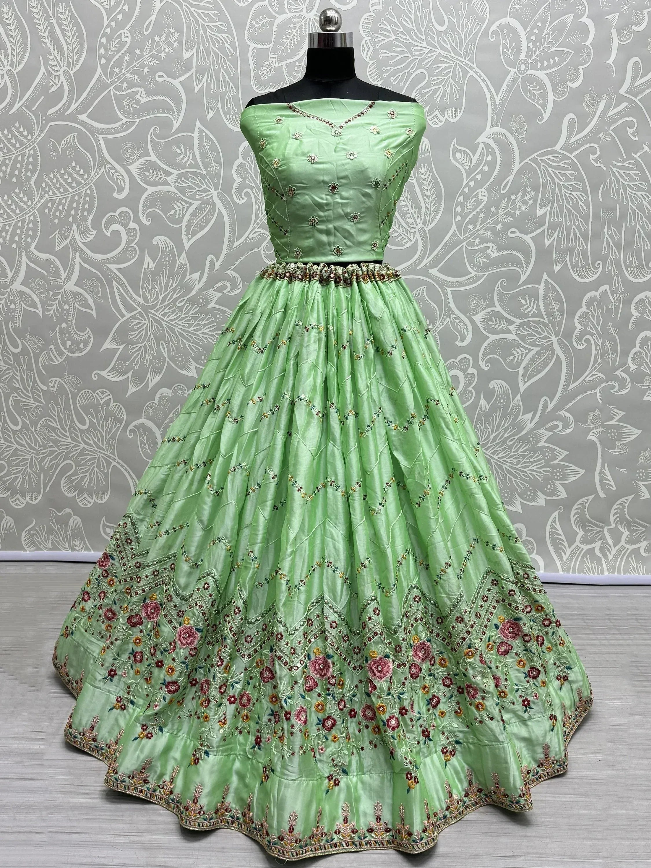 Mint green designer lehenga choli with floral embroidery, perfect for Indian ethnic wear occasions