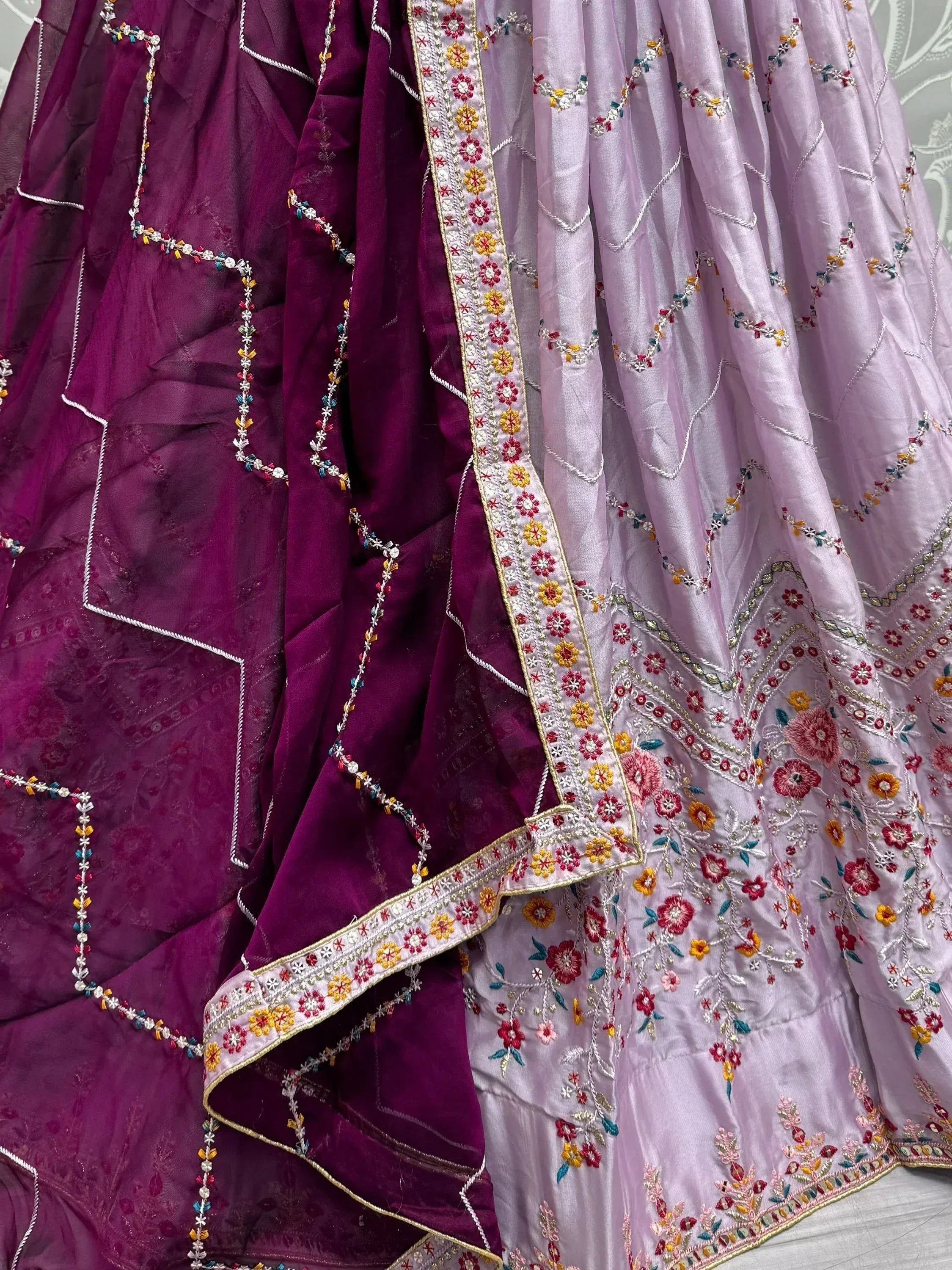 Purple and lavender embroidered lehenga choli with floral thread work and border detailing